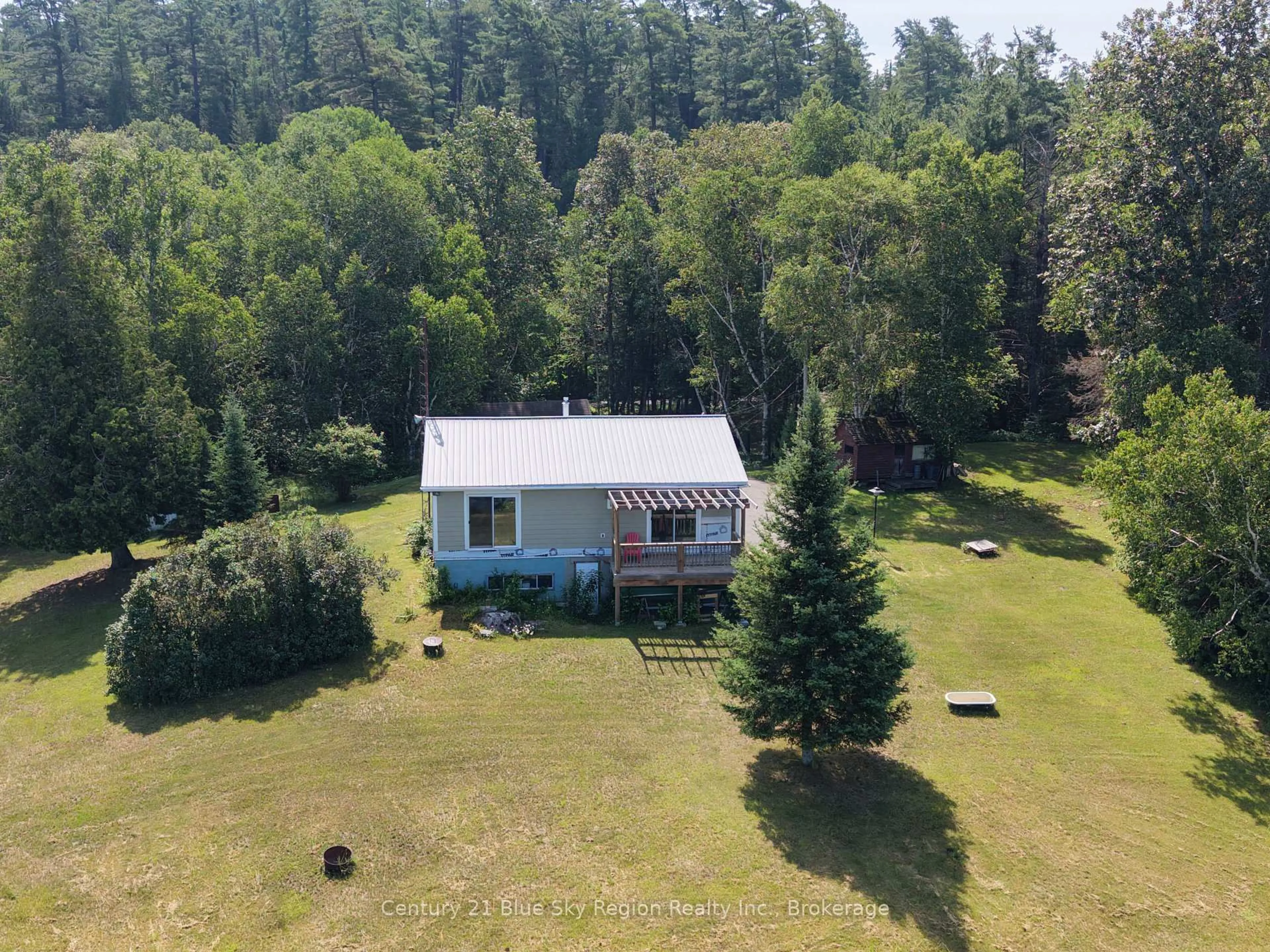 A pic from outside/outdoor area/front of a property/back of a property/a pic from drone, forest/trees view for 24 Beaverland Rd, Unorganized Townships Ontario P0H 1T0
