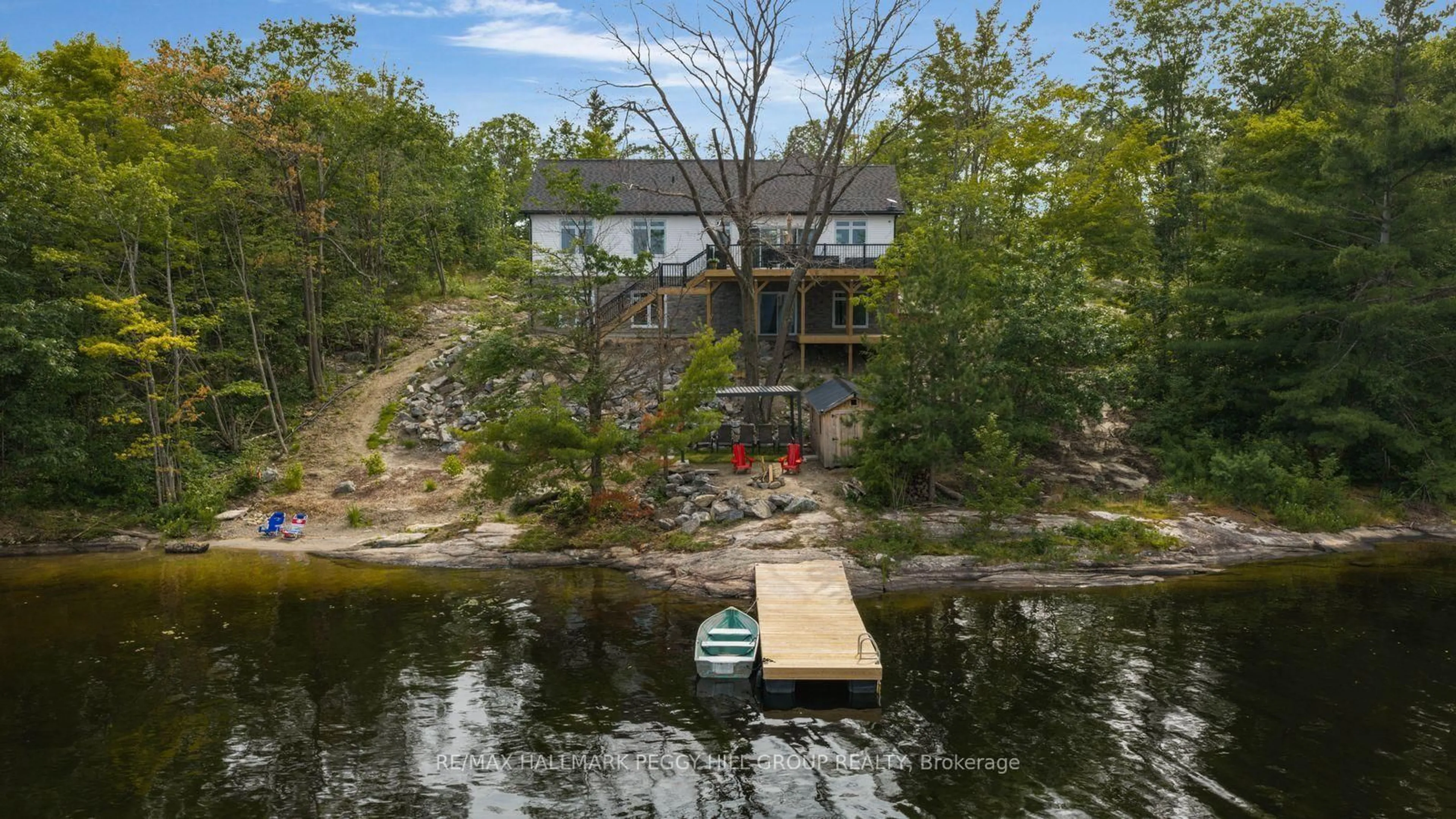 A pic from outside/outdoor area/front of a property/back of a property/a pic from drone, water/lake/river/ocean view for 20 Hawkins Point Rd, Georgian Bay Ontario P0C 1H0