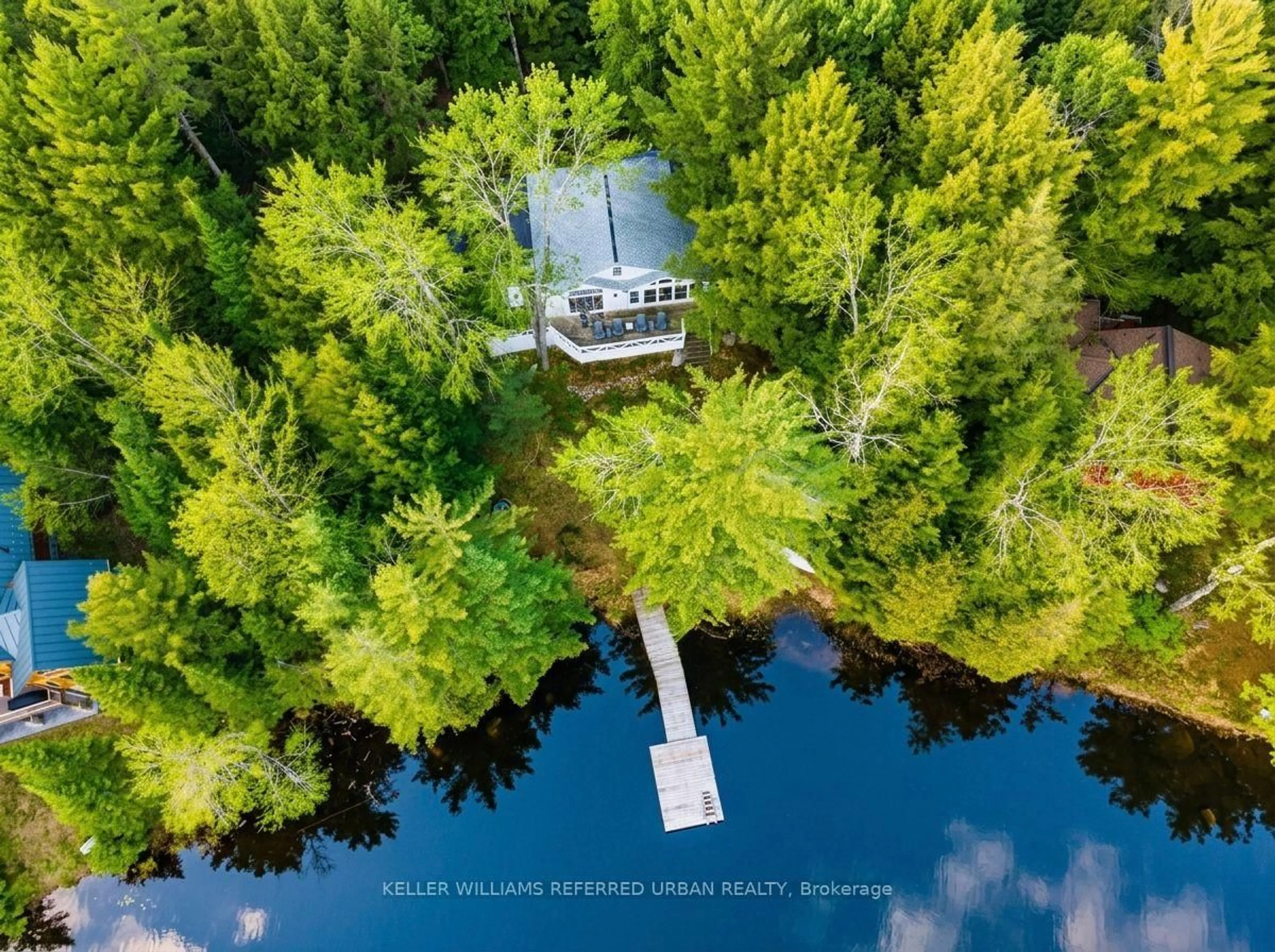 A pic from outside/outdoor area/front of a property/back of a property/a pic from drone, water/lake/river/ocean view for 1118 Pine Lake Shores, Bracebridge Ontario P1L 1X3