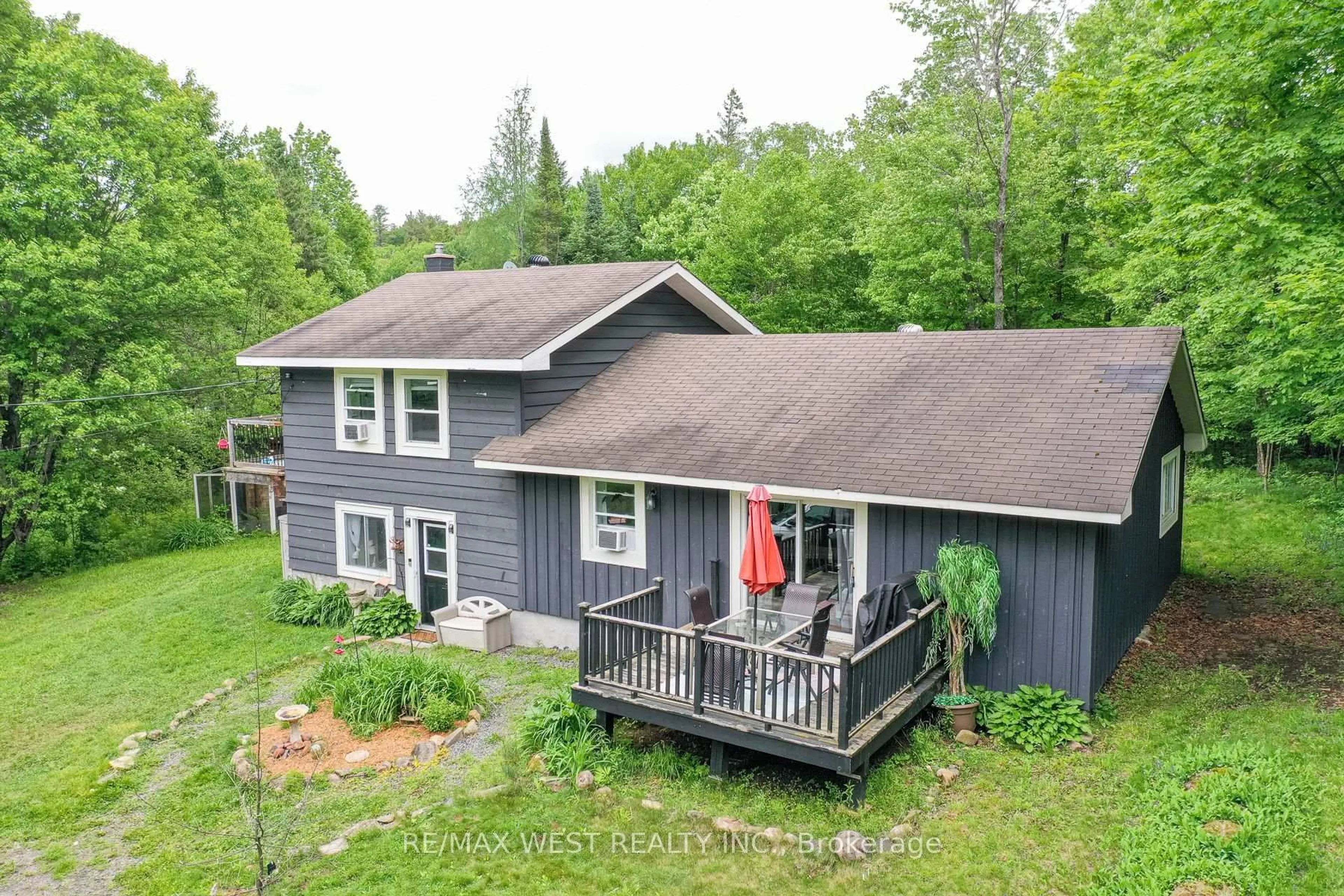 A pic from outside/outdoor area/front of a property/back of a property/a pic from drone, water/lake/river/ocean view for 365 Clearwater Lake Rd, Huntsville Ontario P0B 1L0