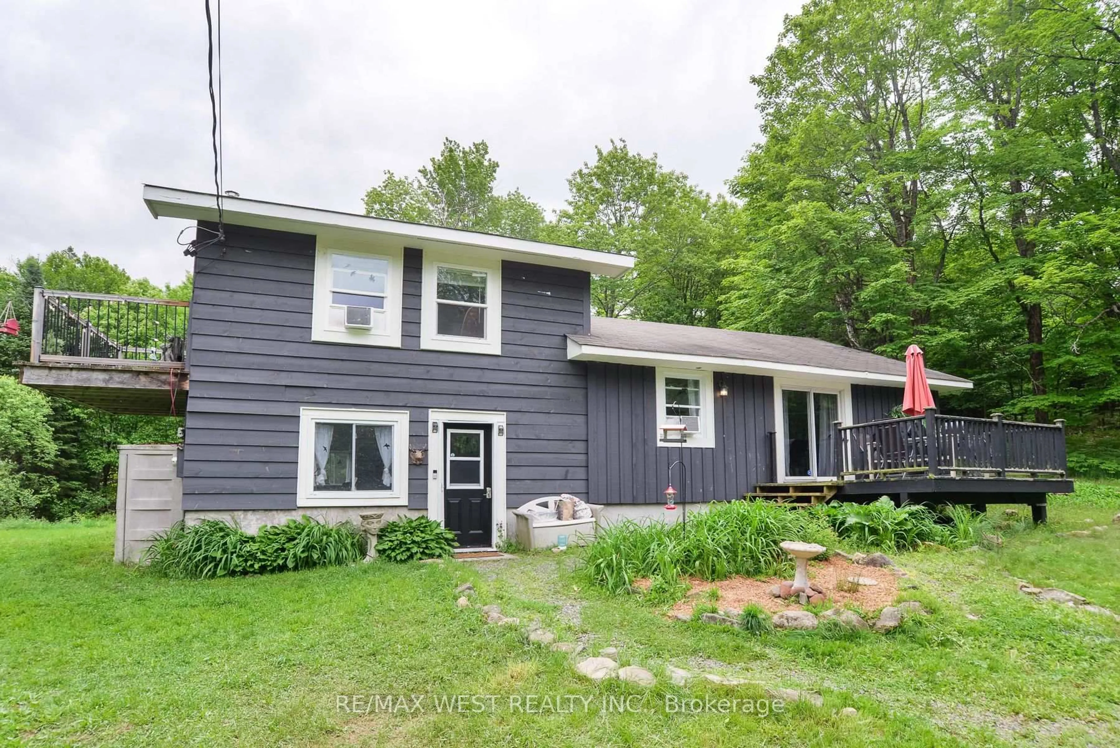 Home with vinyl exterior material, street for 365 Clearwater Lake Rd, Huntsville Ontario P0B 1L0