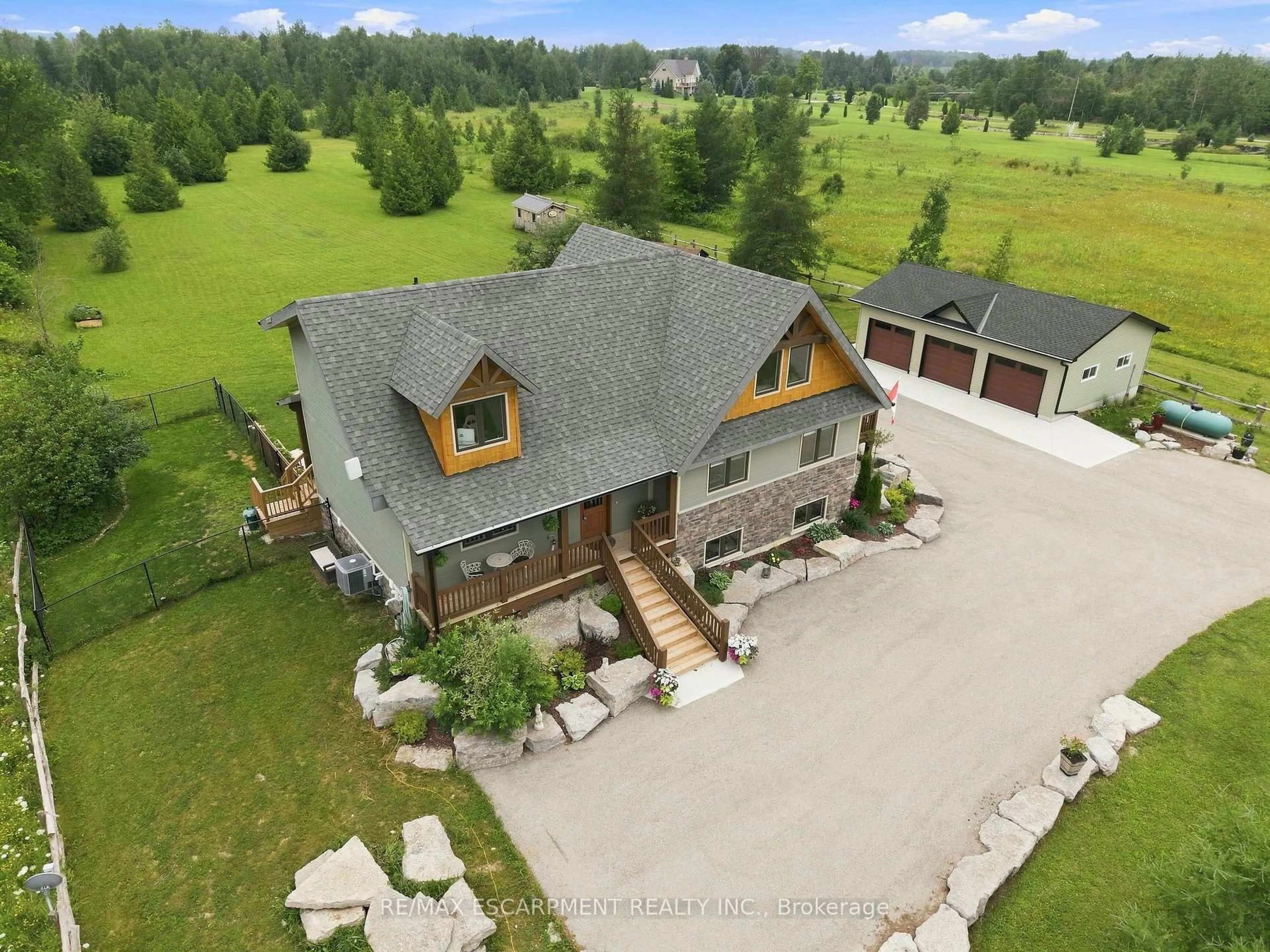 A pic from outside/outdoor area/front of a property/back of a property/a pic from drone, mountain view for 124288 Southgate Road 12, Southgate Ontario N0G 2A0