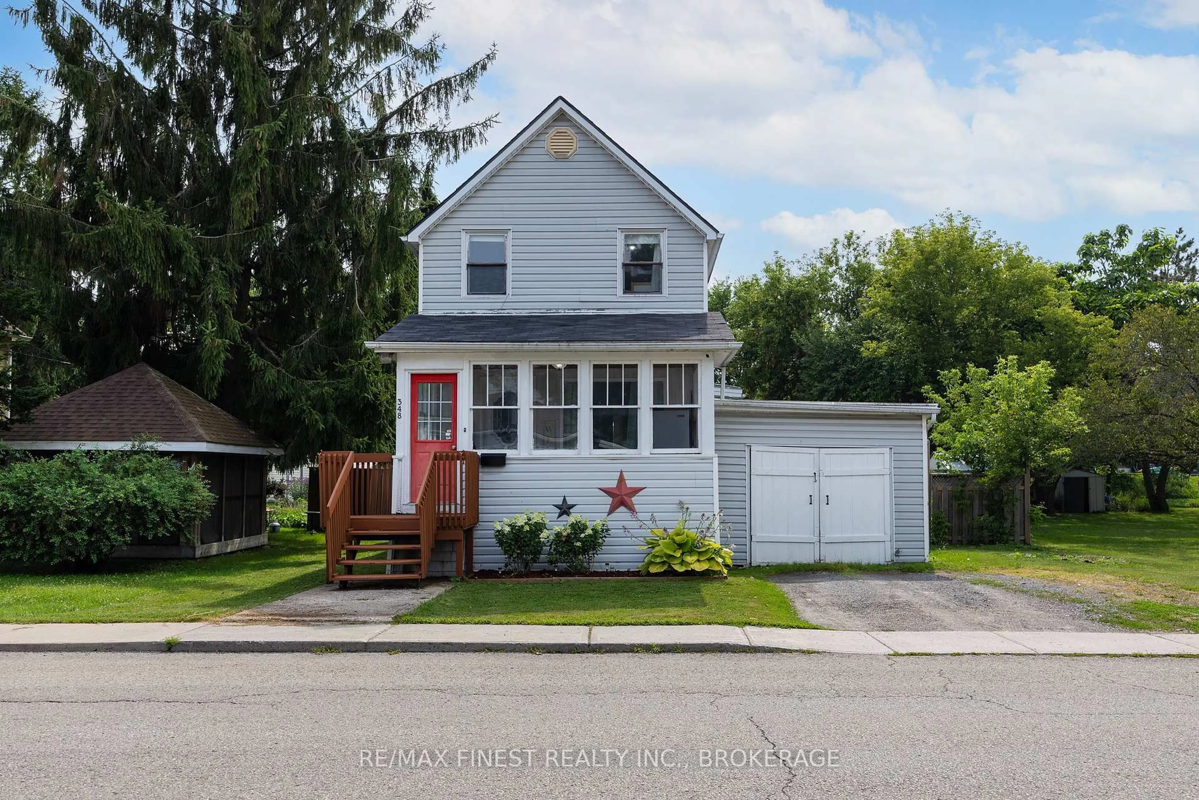 Home with vinyl exterior material, street for 348 Charles St, Gananoque Ontario K7G 1V4