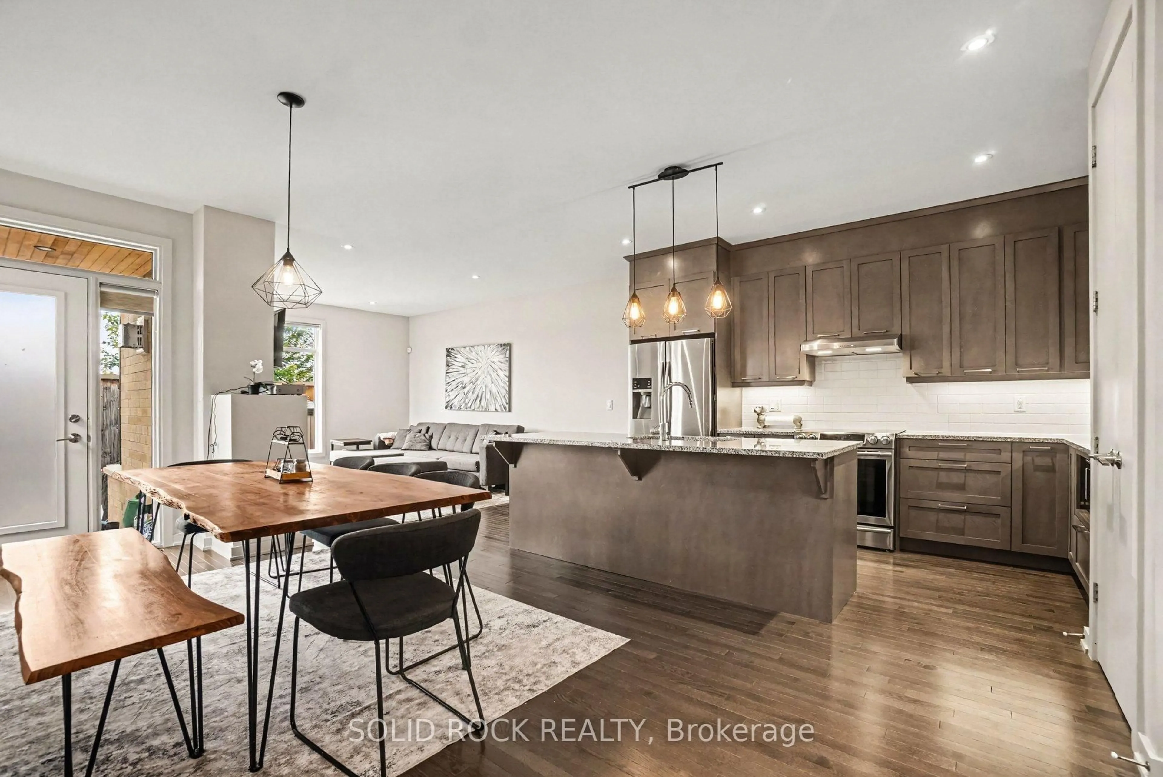 Open concept kitchen, wood/laminate floor for 114 Larimar Circ, Ottawa Ontario K1X 0B7