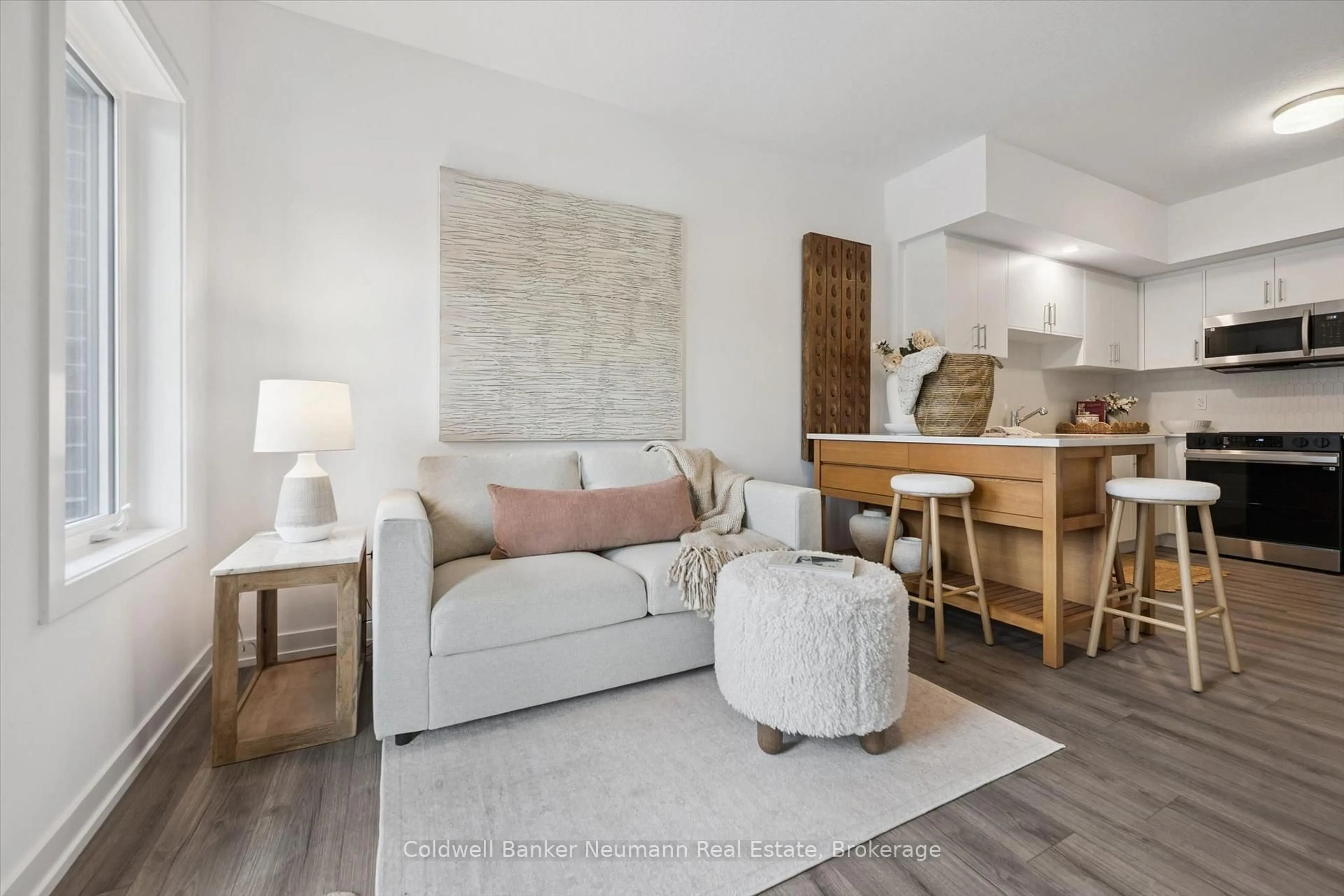 Living room with furniture, wood/laminate floor for 940 St. David St #78, Centre Wellington Ontario N1M 0L7