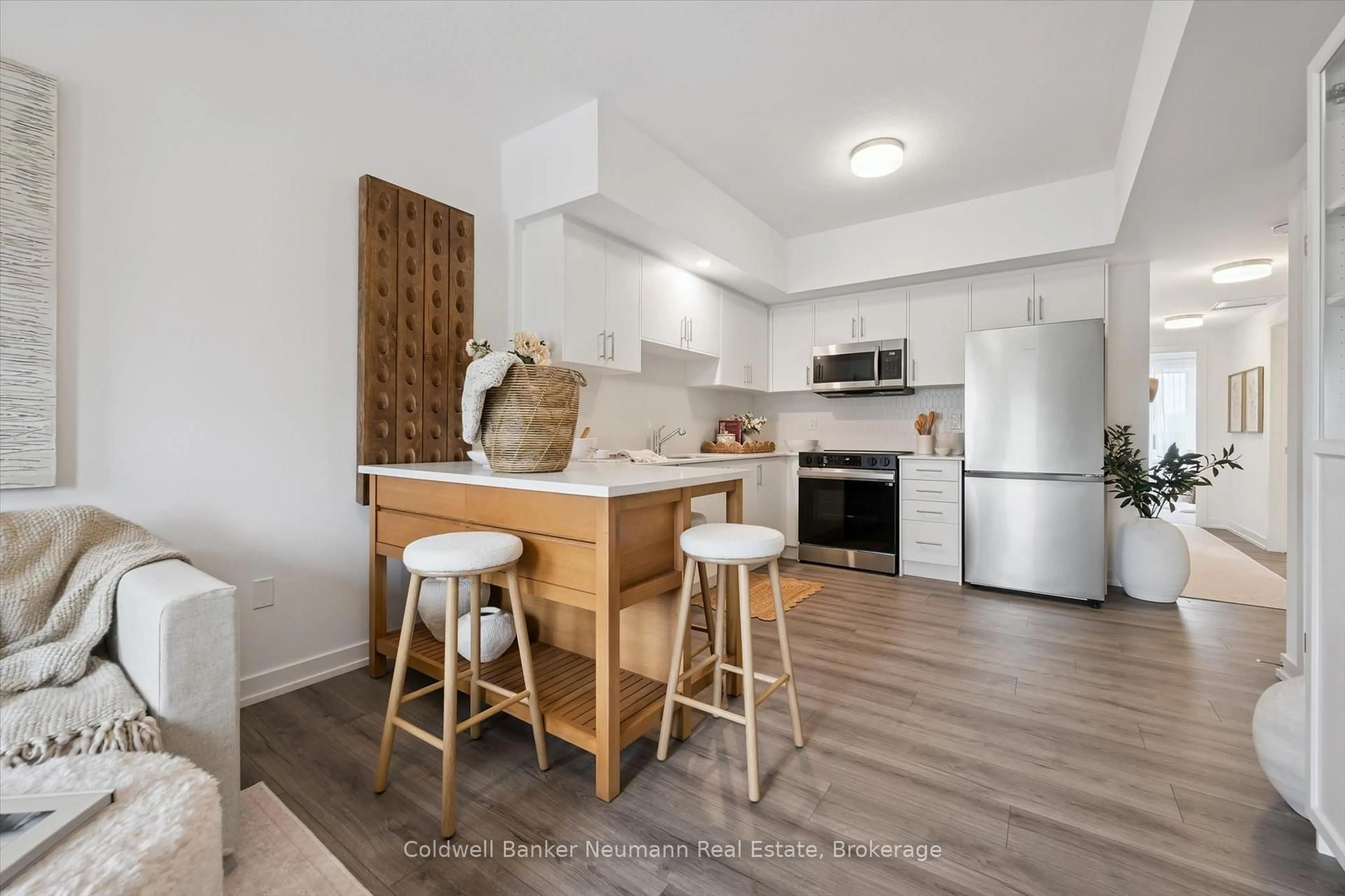 Open concept kitchen, wood/laminate floor for 940 St. David St #78, Centre Wellington Ontario N1M 0L7
