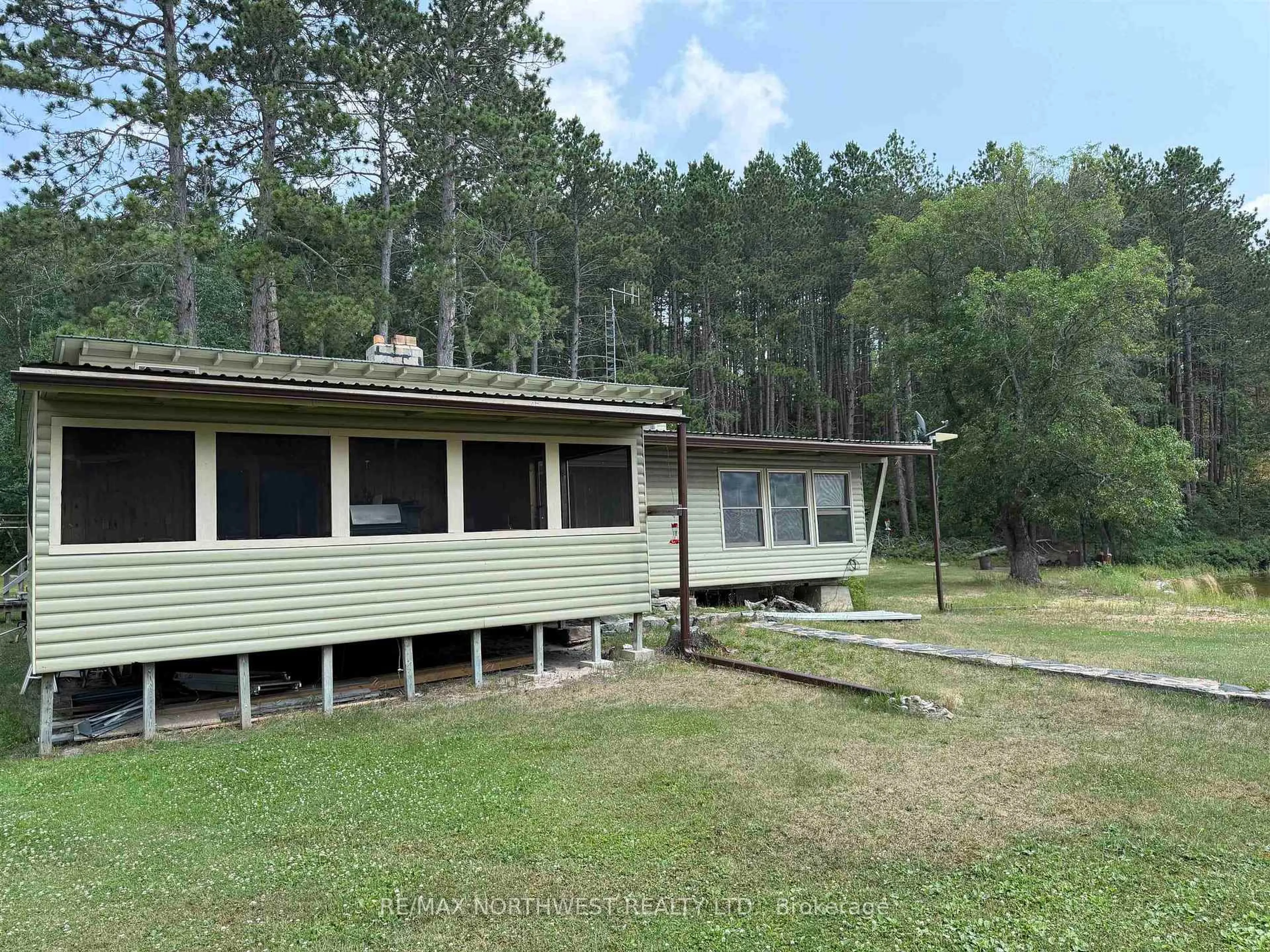 A pic from outside/outdoor area/front of a property/back of a property/a pic from drone, building for 11760A PCL Red Gut, Rainy River Remote Area Ontario P9A 3M3