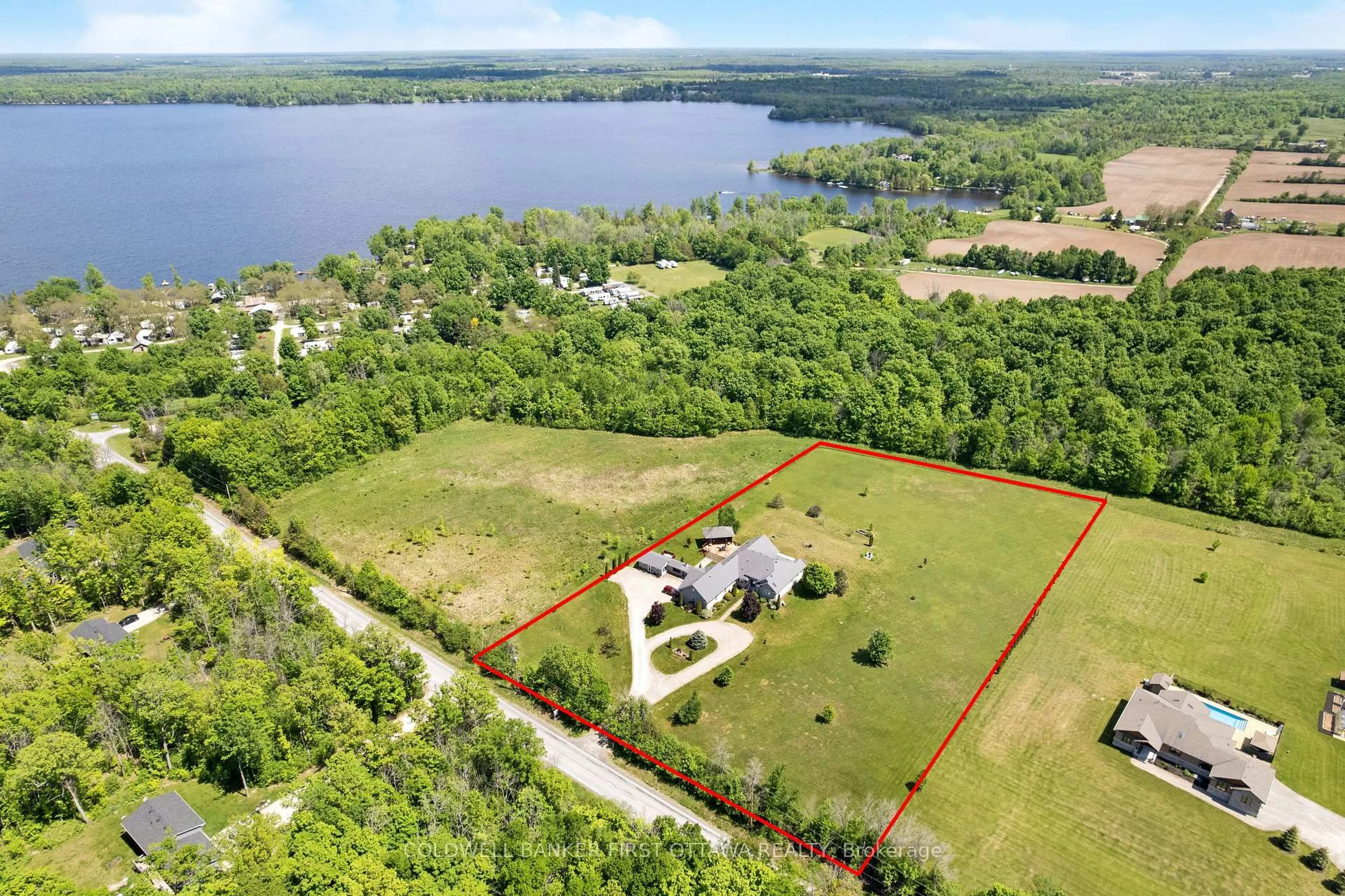 A pic from outside/outdoor area/front of a property/back of a property/a pic from drone, water/lake/river/ocean view for 1111 West Shore Dr, Perth Ontario K7H 0J3
