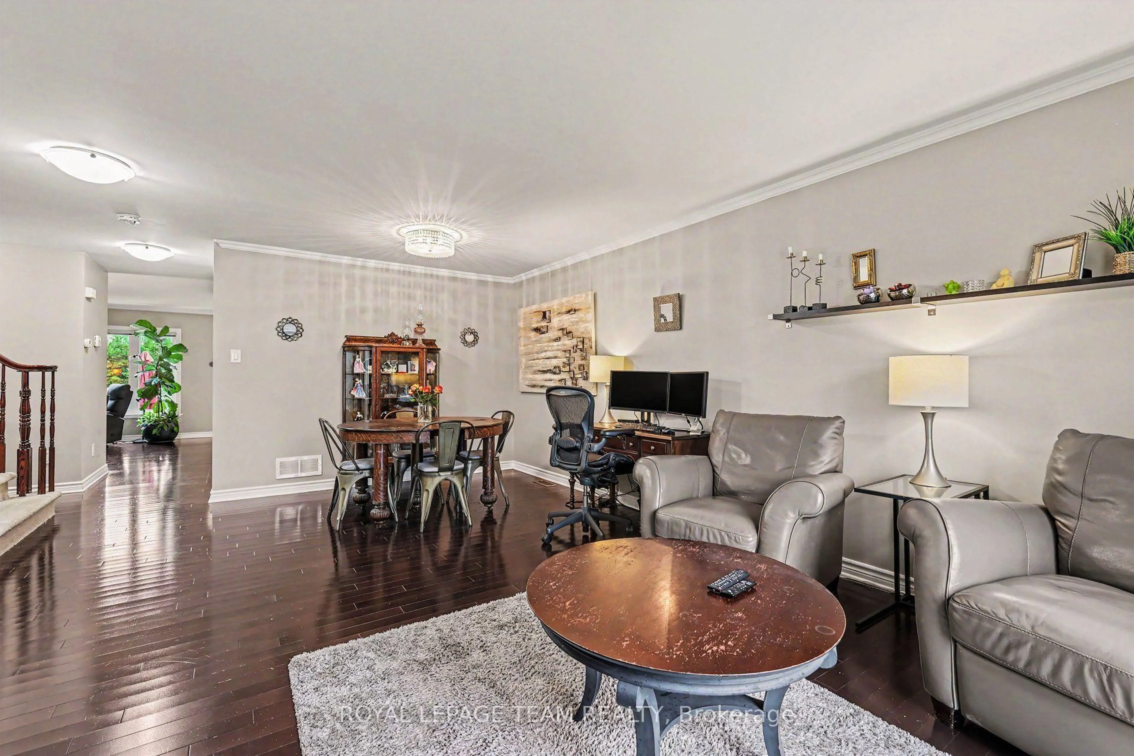 Living room with furniture, wood/laminate floor for 414 Abbeydale Circ, Ottawa Ontario K2K 0E8