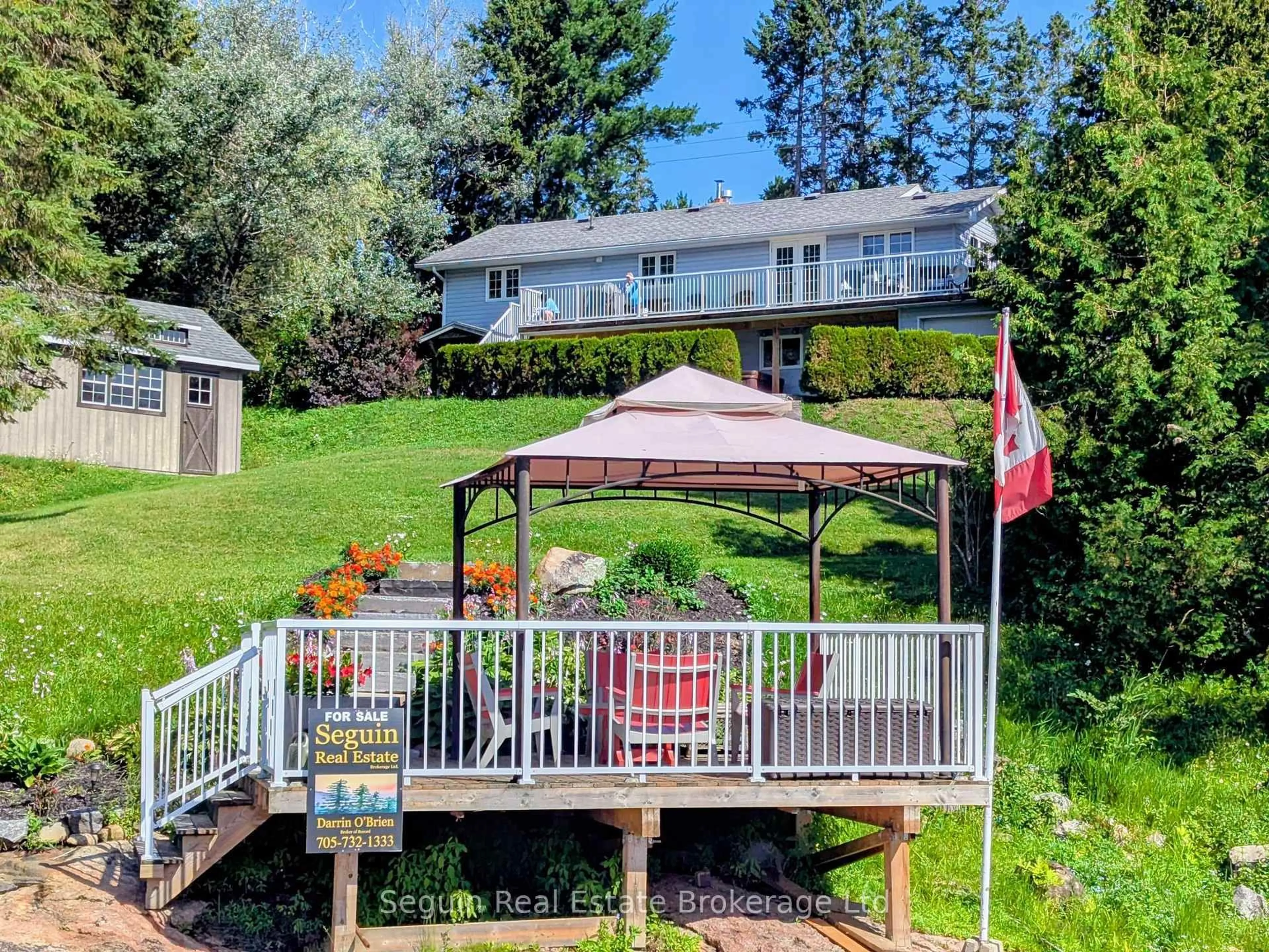 A pic from outside/outdoor area/front of a property/back of a property/a pic from drone, water/lake/river/ocean view for 1091 HIGHWAY 518 Highway, Seguin Ontario P2A 0B6
