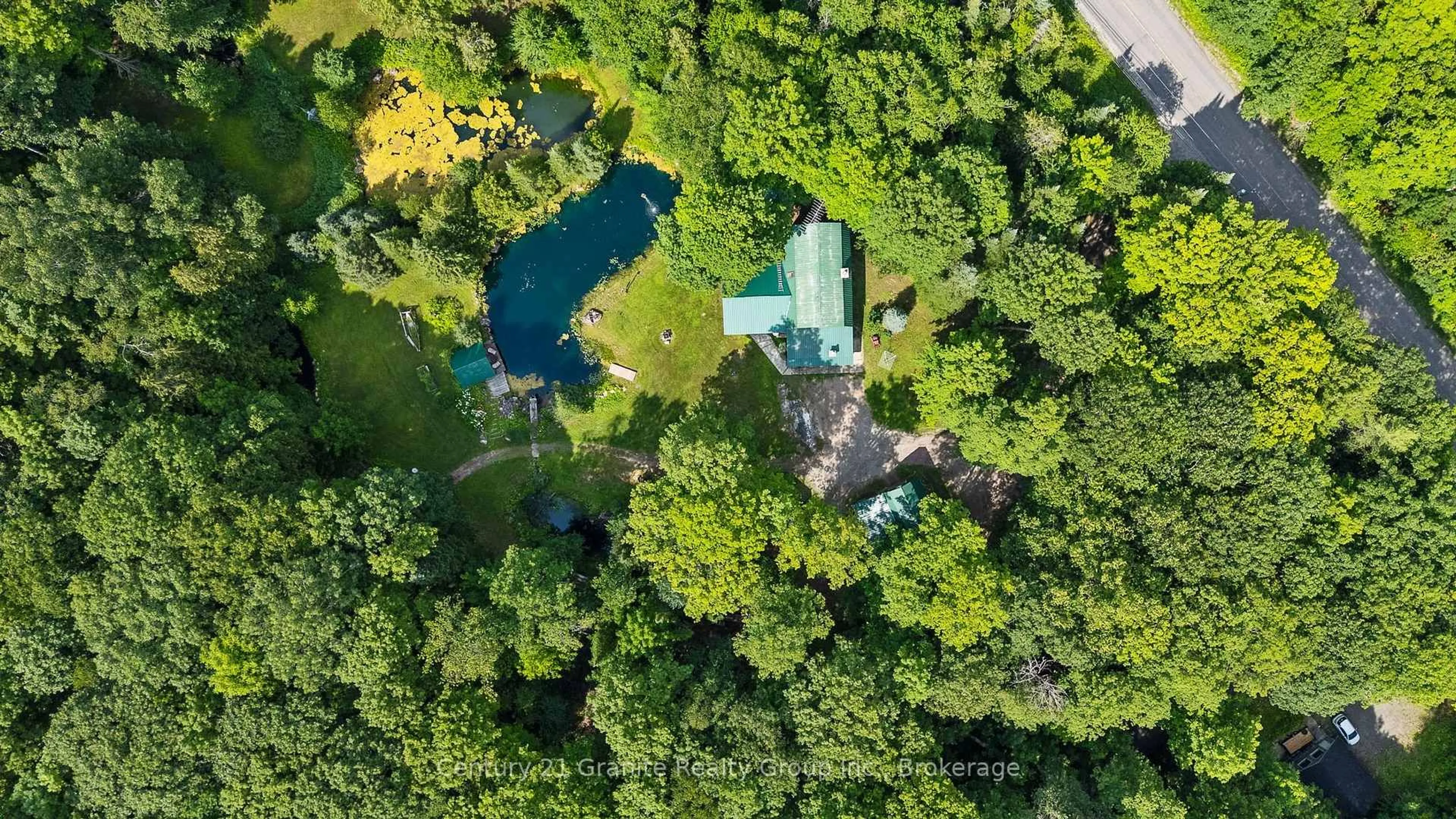 A pic from outside/outdoor area/front of a property/back of a property/a pic from drone, forest/trees view for 1291 Horseshoe Lake Rd, Minden Hills Ontario K0M 2K0