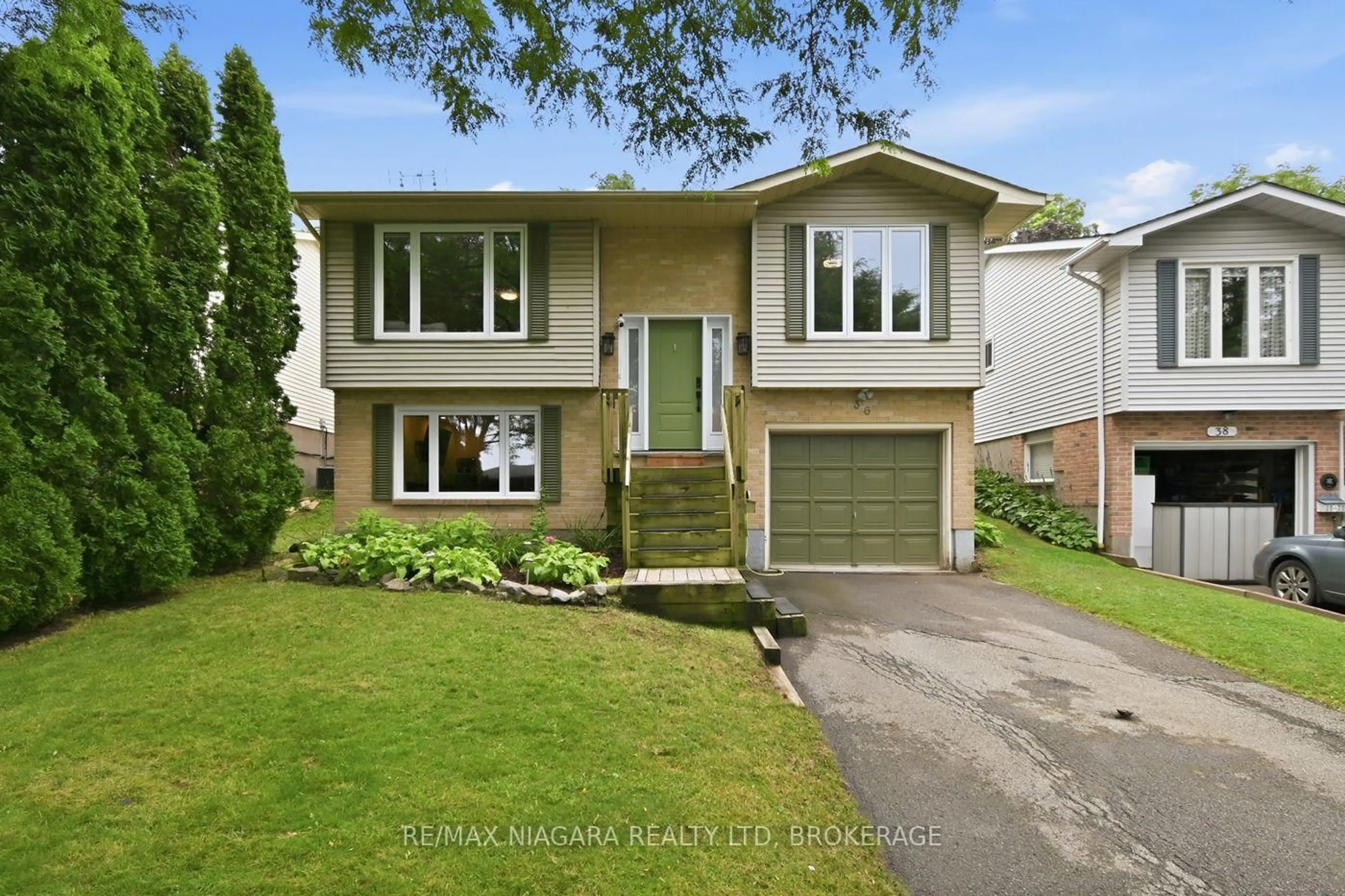 Home with vinyl exterior material, street for 36 Hemlock St, St. Catharines Ontario L2T 4B7