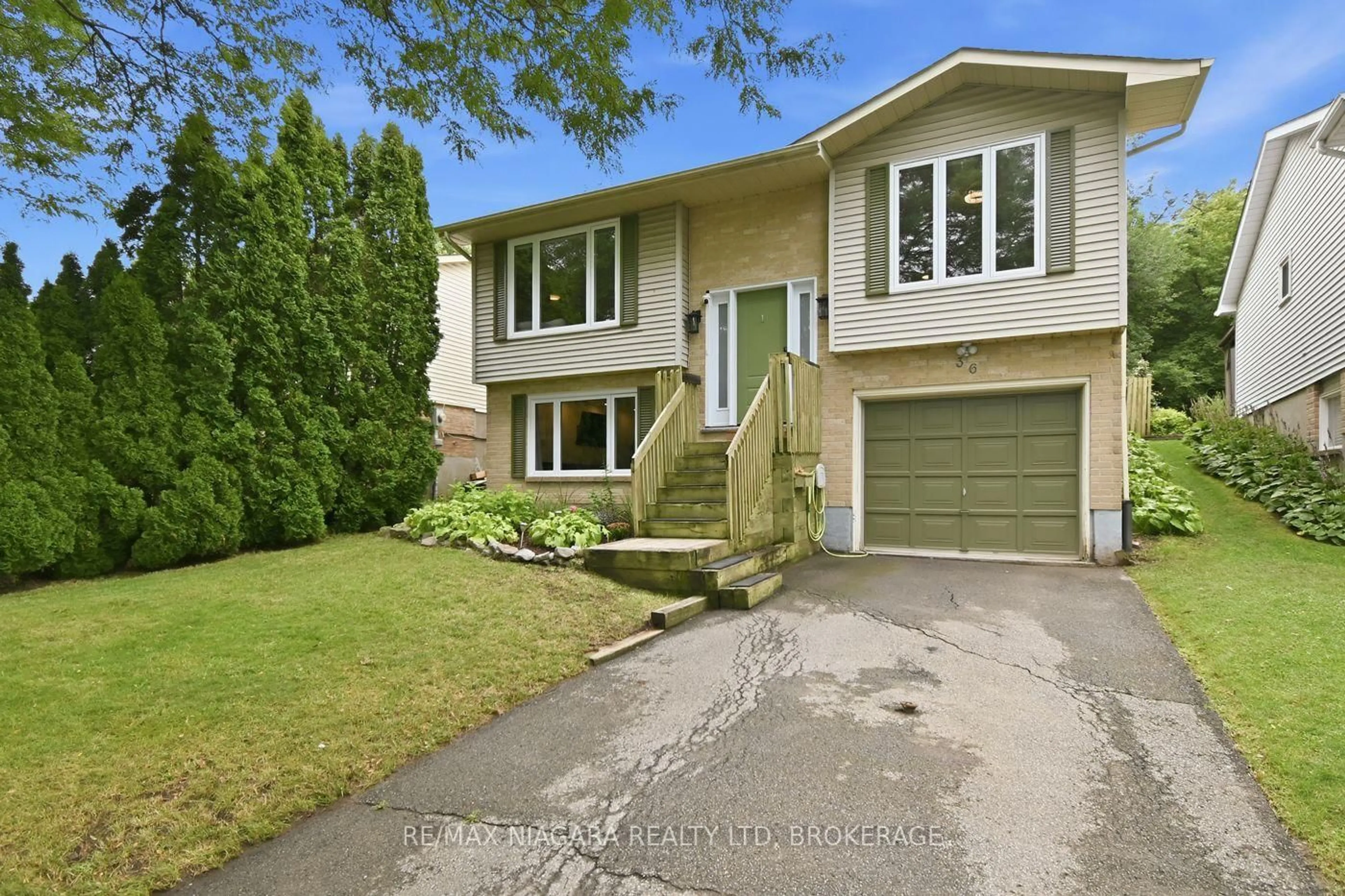 Home with vinyl exterior material, street for 36 Hemlock St, St. Catharines Ontario L2T 4B7