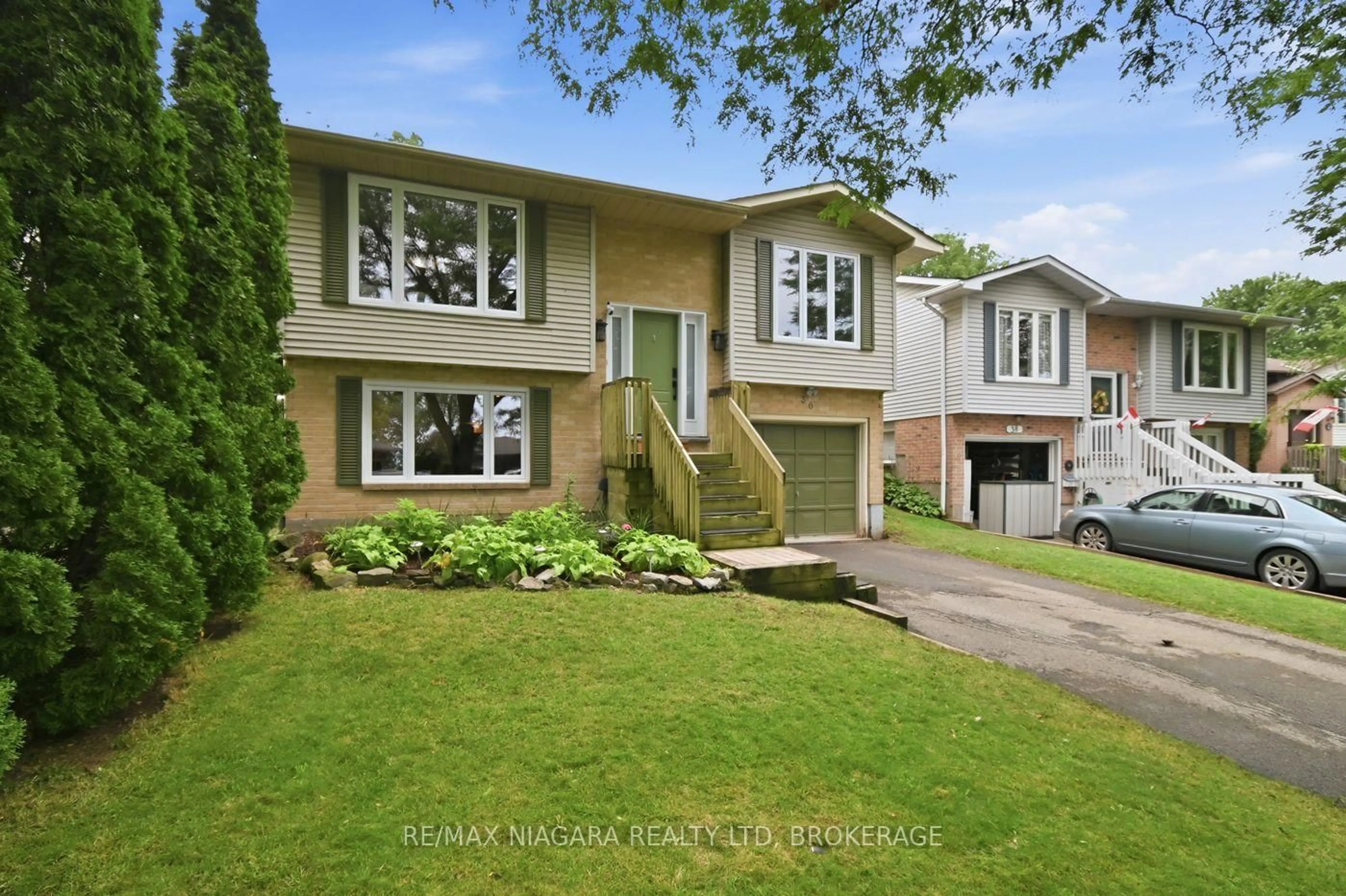 Home with brick exterior material, street for 36 Hemlock St, St. Catharines Ontario L2T 4B7