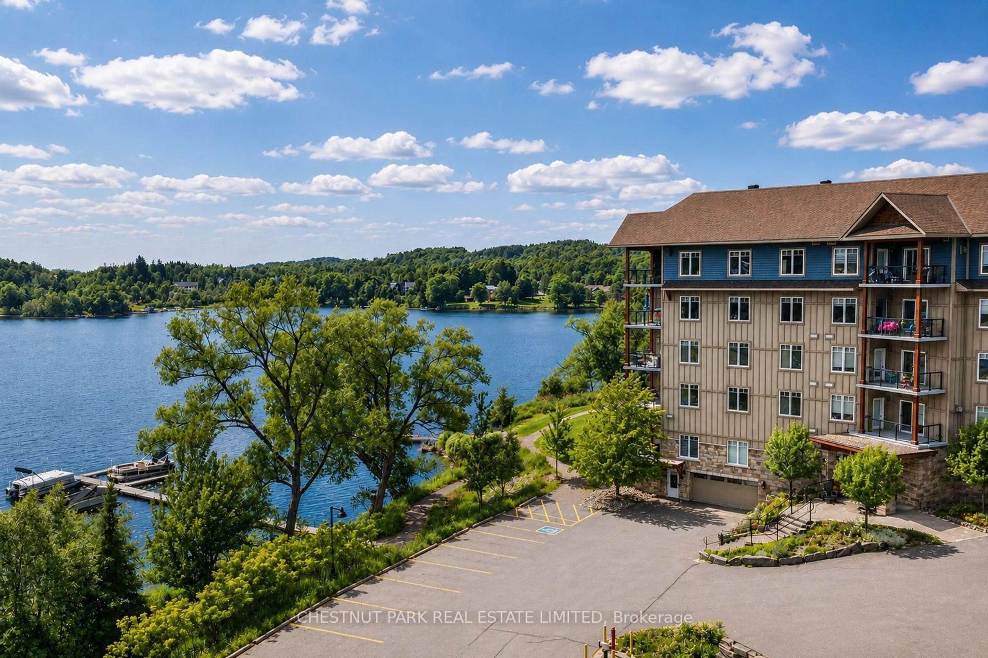 A pic from outside/outdoor area/front of a property/back of a property/a pic from drone, water/lake/river/ocean view for 1 Park St #201, Dysart et al Ontario K0M 1S0
