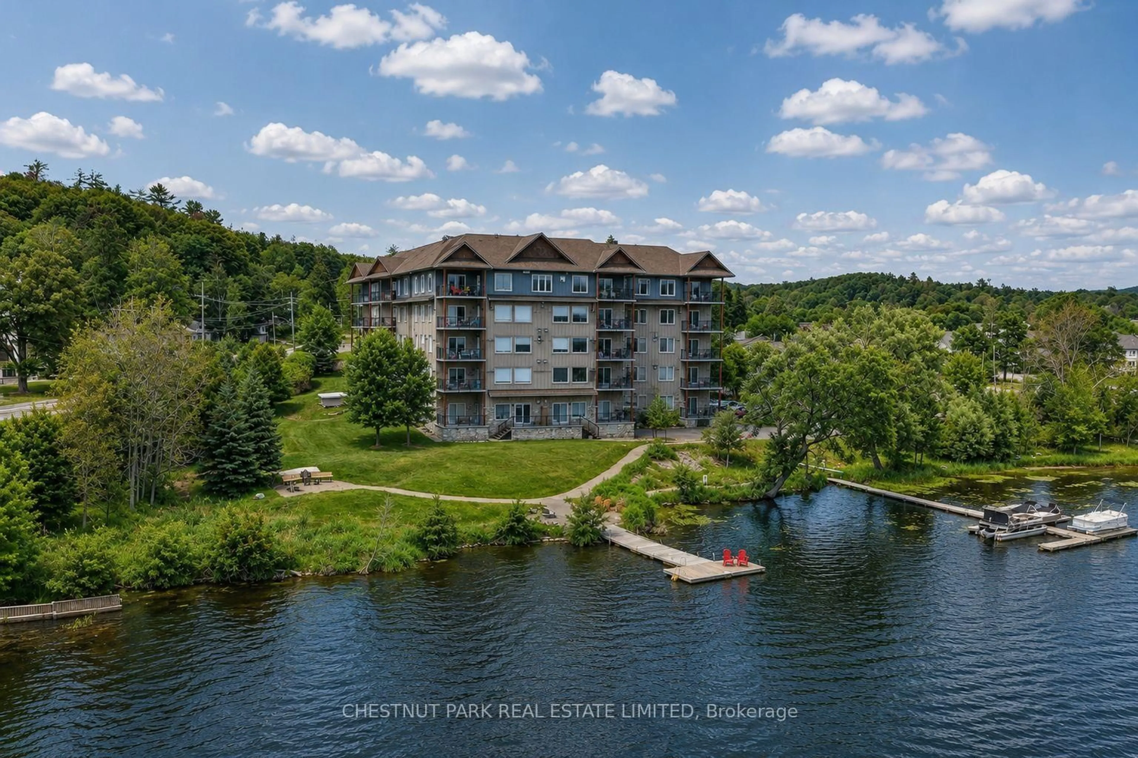 A pic from outside/outdoor area/front of a property/back of a property/a pic from drone, water/lake/river/ocean view for 1 Park St #201, Dysart et al Ontario K0M 1S0
