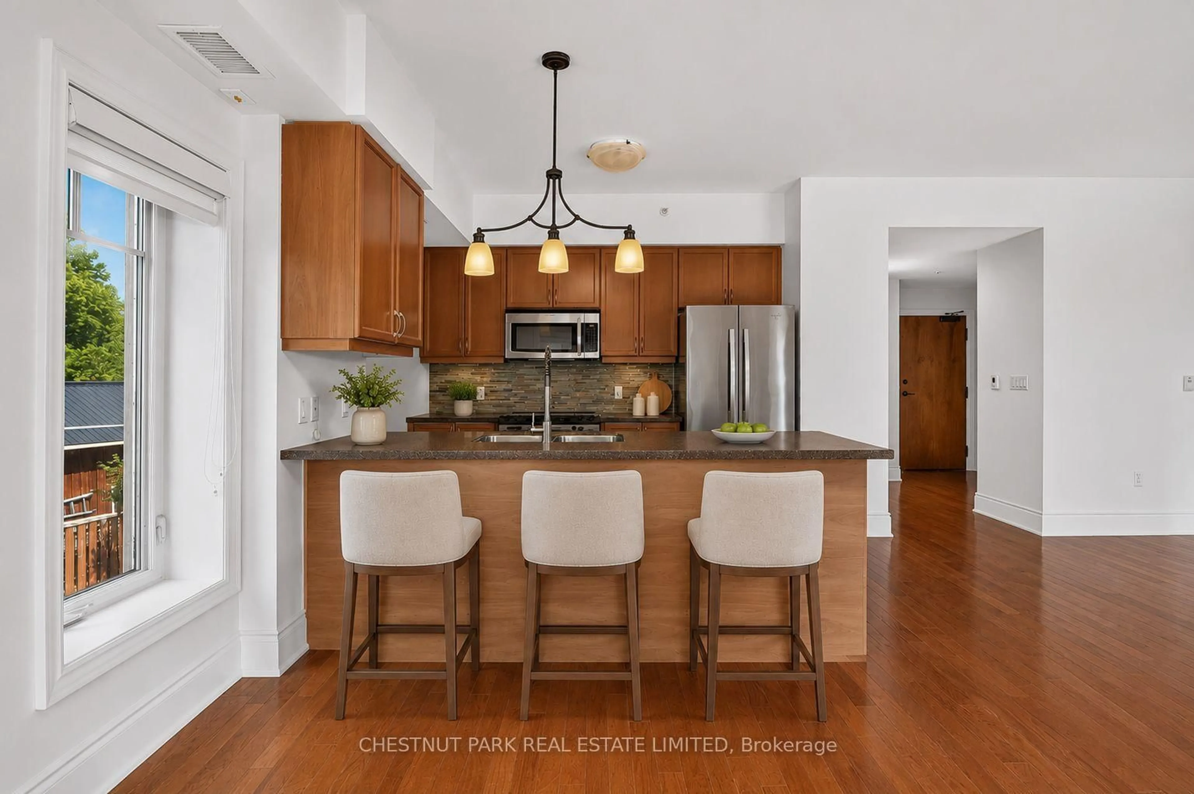Open concept kitchen, ceramic/tile floor for 1 Park St #201, Dysart et al Ontario K0M 1S0