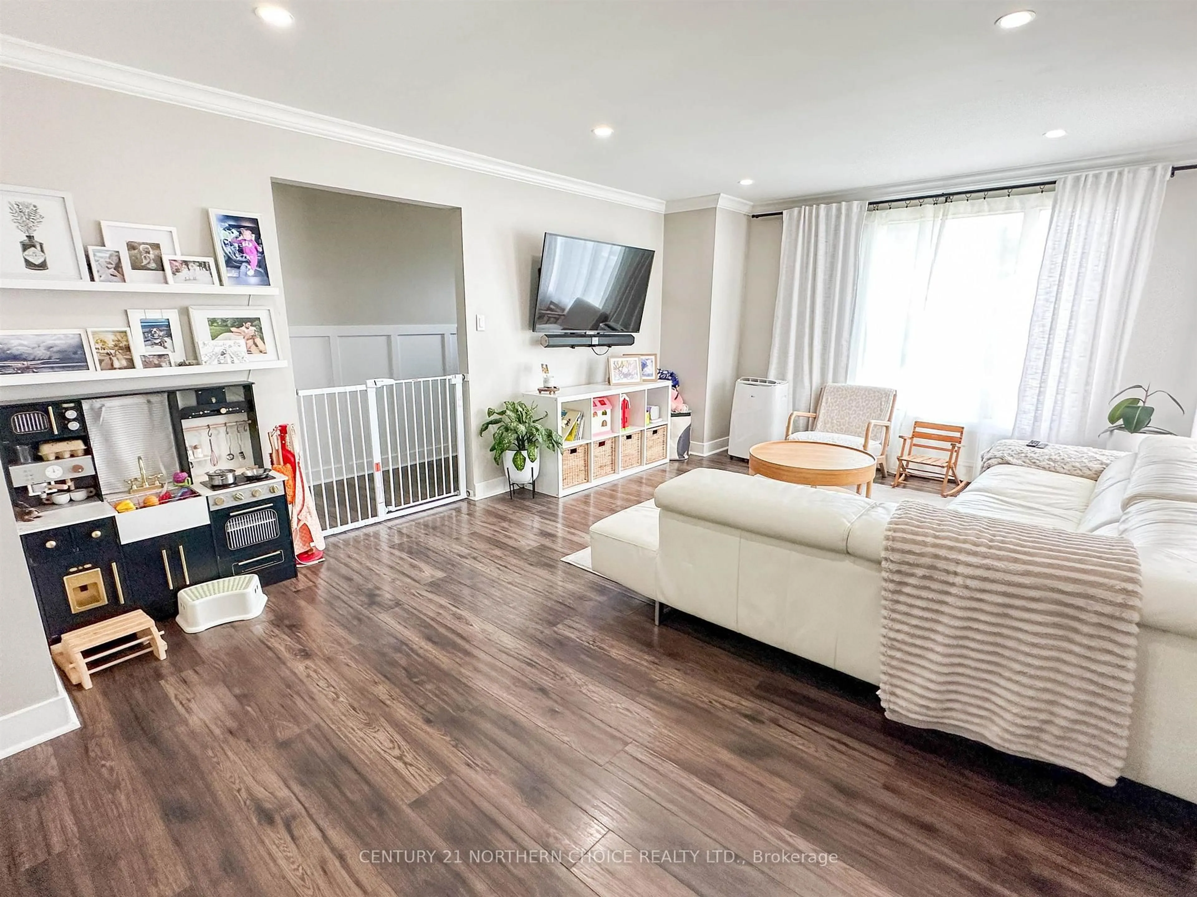 Living room with furniture, wood/laminate floor for 73 Dickenson Rd, Red Lake Ontario P0V 1C0