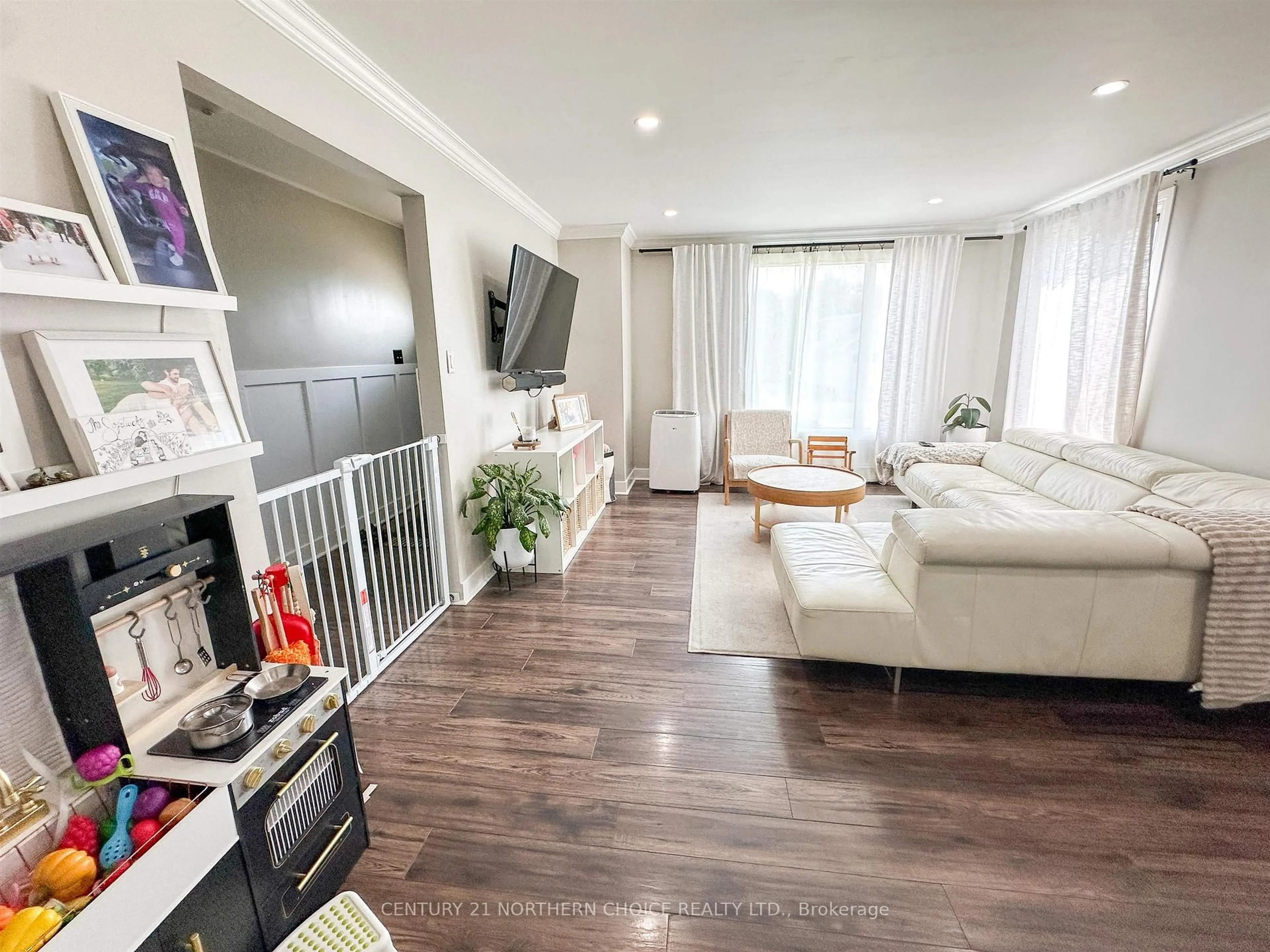 Living room with furniture, wood/laminate floor for 73 Dickenson Rd, Red Lake Ontario P0V 1C0