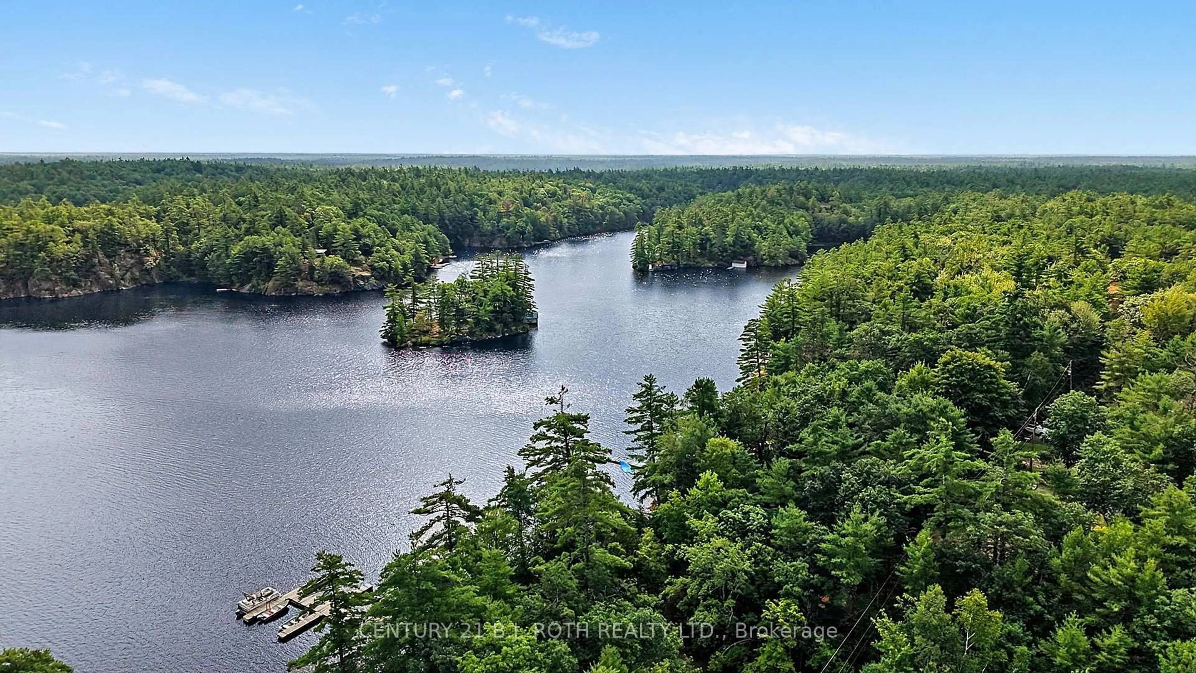 A pic from outside/outdoor area/front of a property/back of a property/a pic from drone, water/lake/river/ocean view for 1100 Hewitt St, Gravenhurst Ontario P1P 0C1