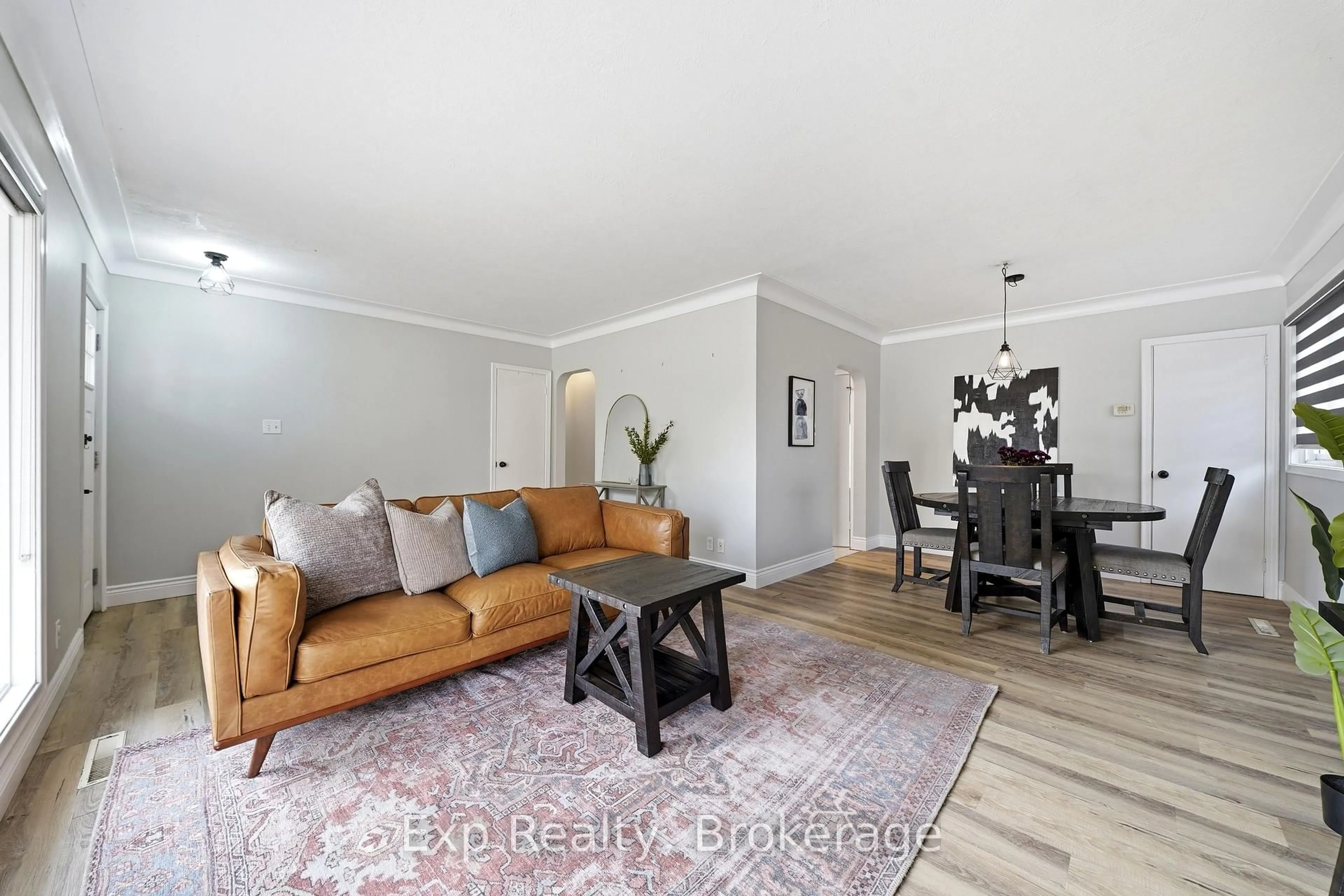 Living room with furniture, wood/laminate floor for 6 Coleman Dr, Quinte West Ontario K8V 3A5