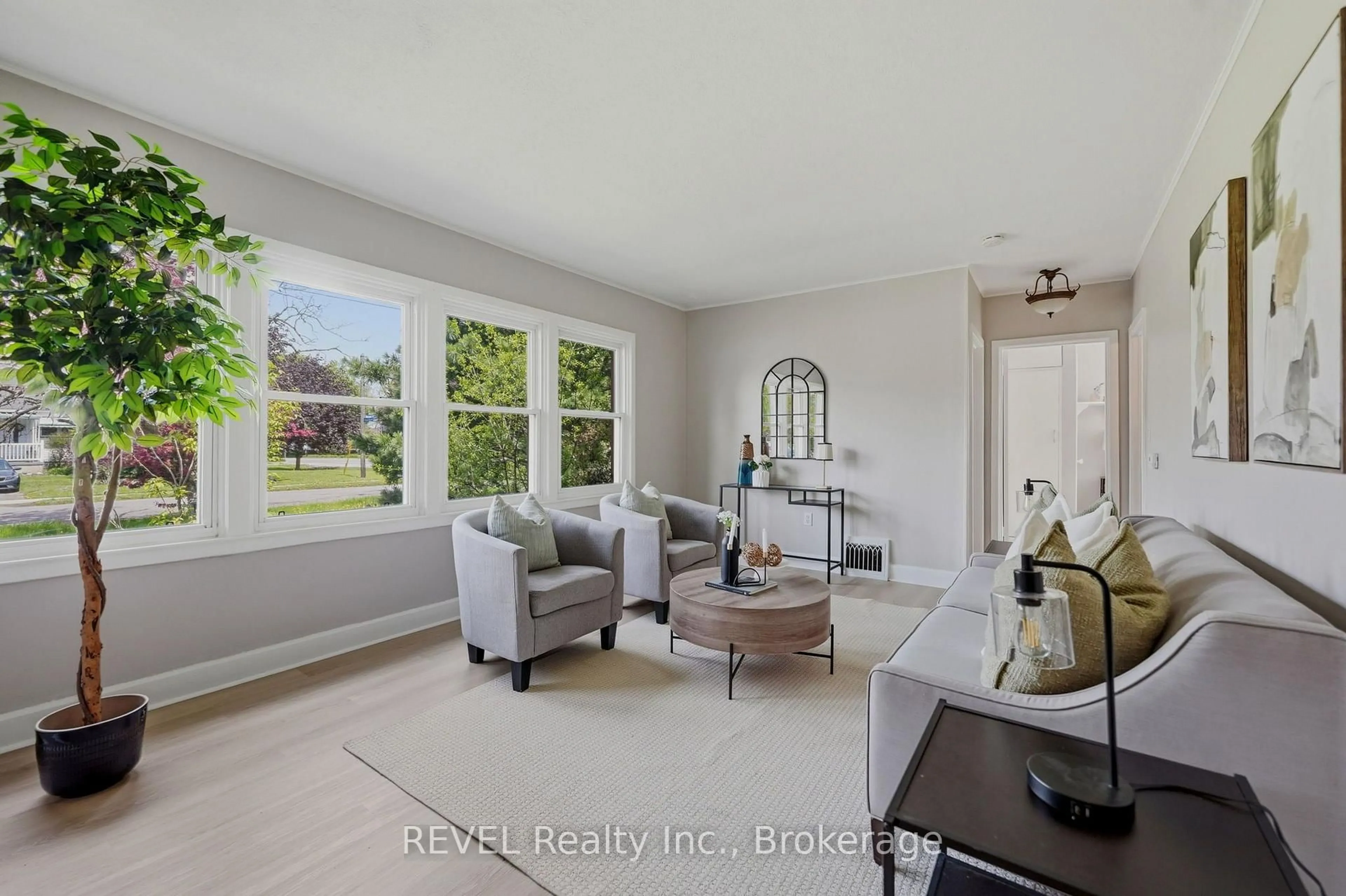 Living room with furniture, ceramic/tile floor for 7962 Booth St, Niagara Falls Ontario L2H 1E8