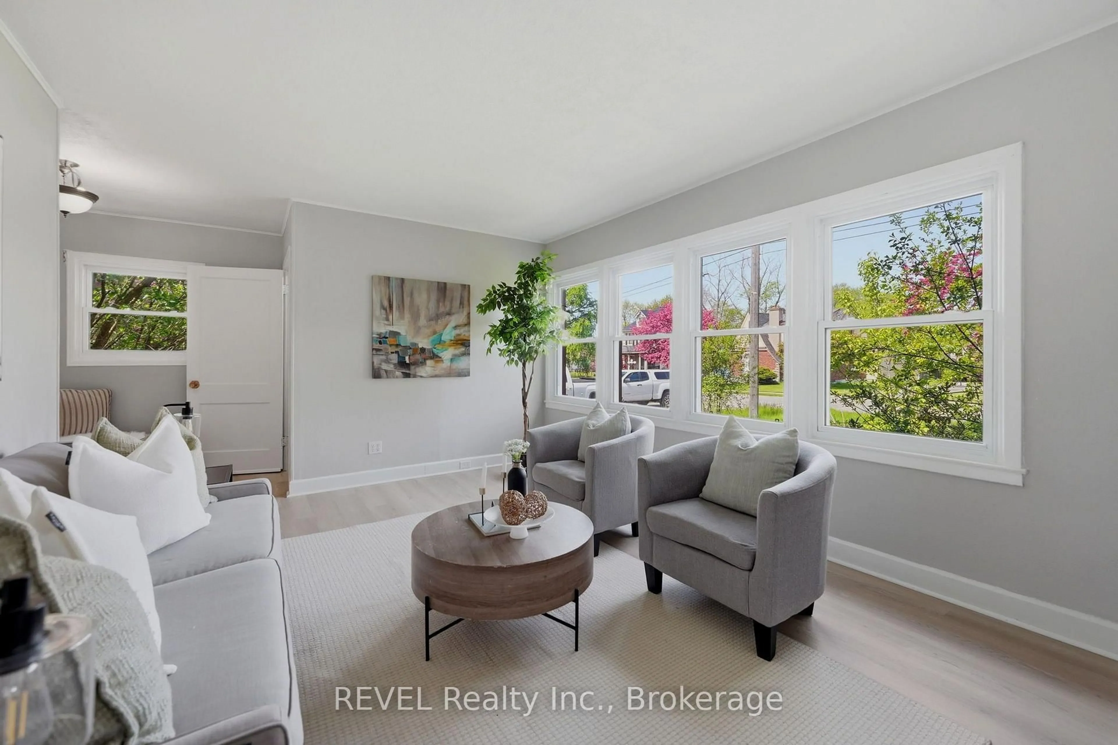 Living room with furniture, ceramic/tile floor for 7962 Booth St, Niagara Falls Ontario L2H 1E8