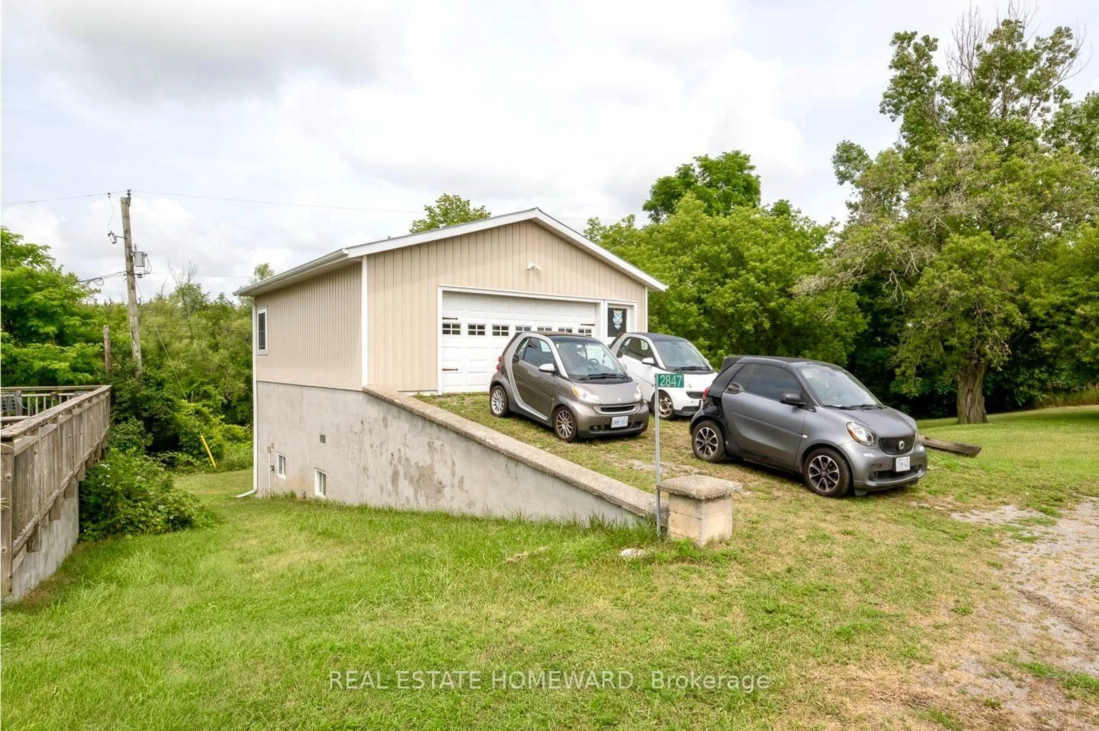 A pic from outside/outdoor area/front of a property/back of a property/a pic from drone, street for 2847 County Rd 10 Rd, Prince Edward County Ontario K0K 2T0