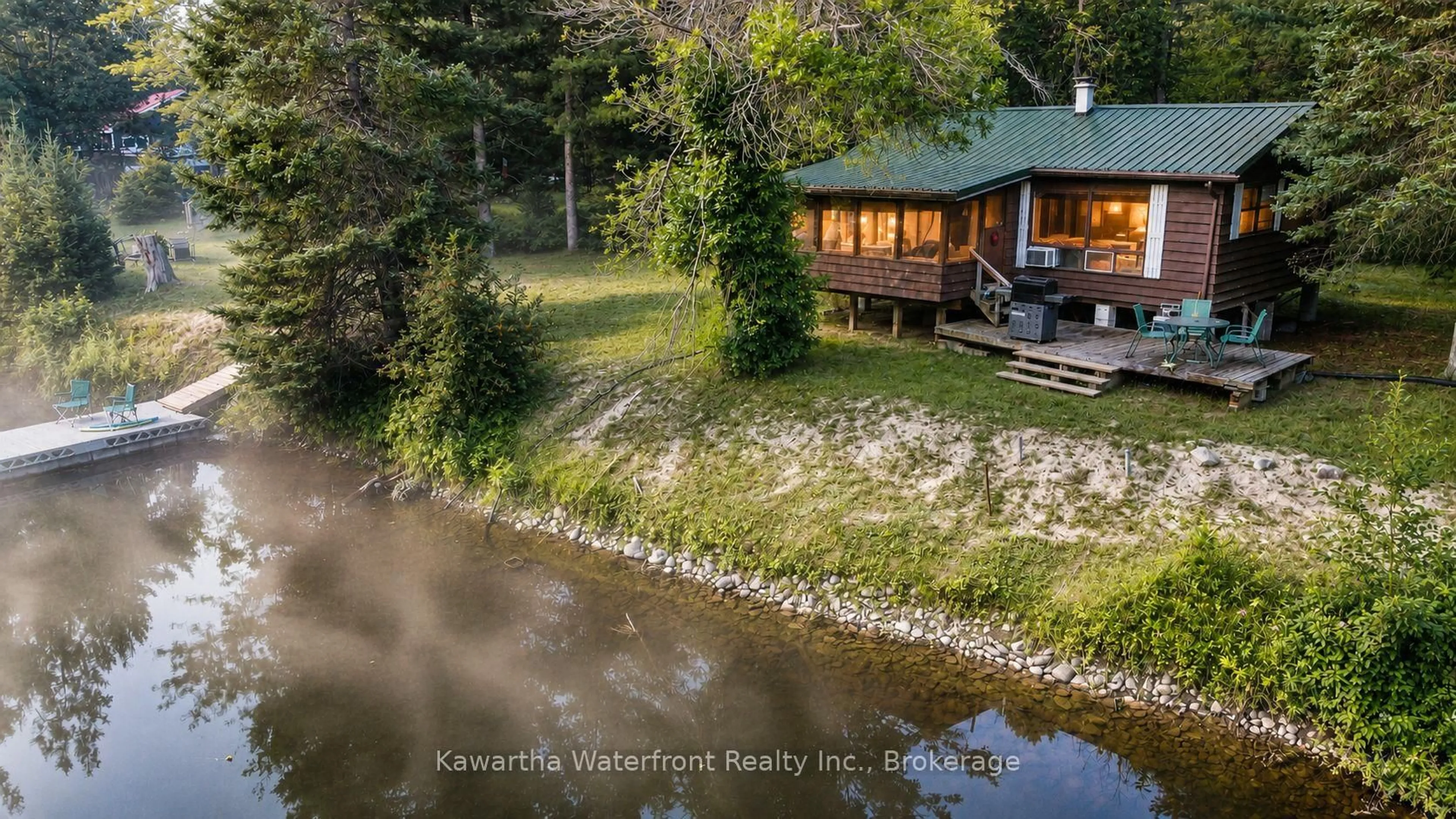 A pic from outside/outdoor area/front of a property/back of a property/a pic from drone, water/lake/river/ocean view for 1035 Nystedt Lane, Minden Hills Ontario K0M 2A1