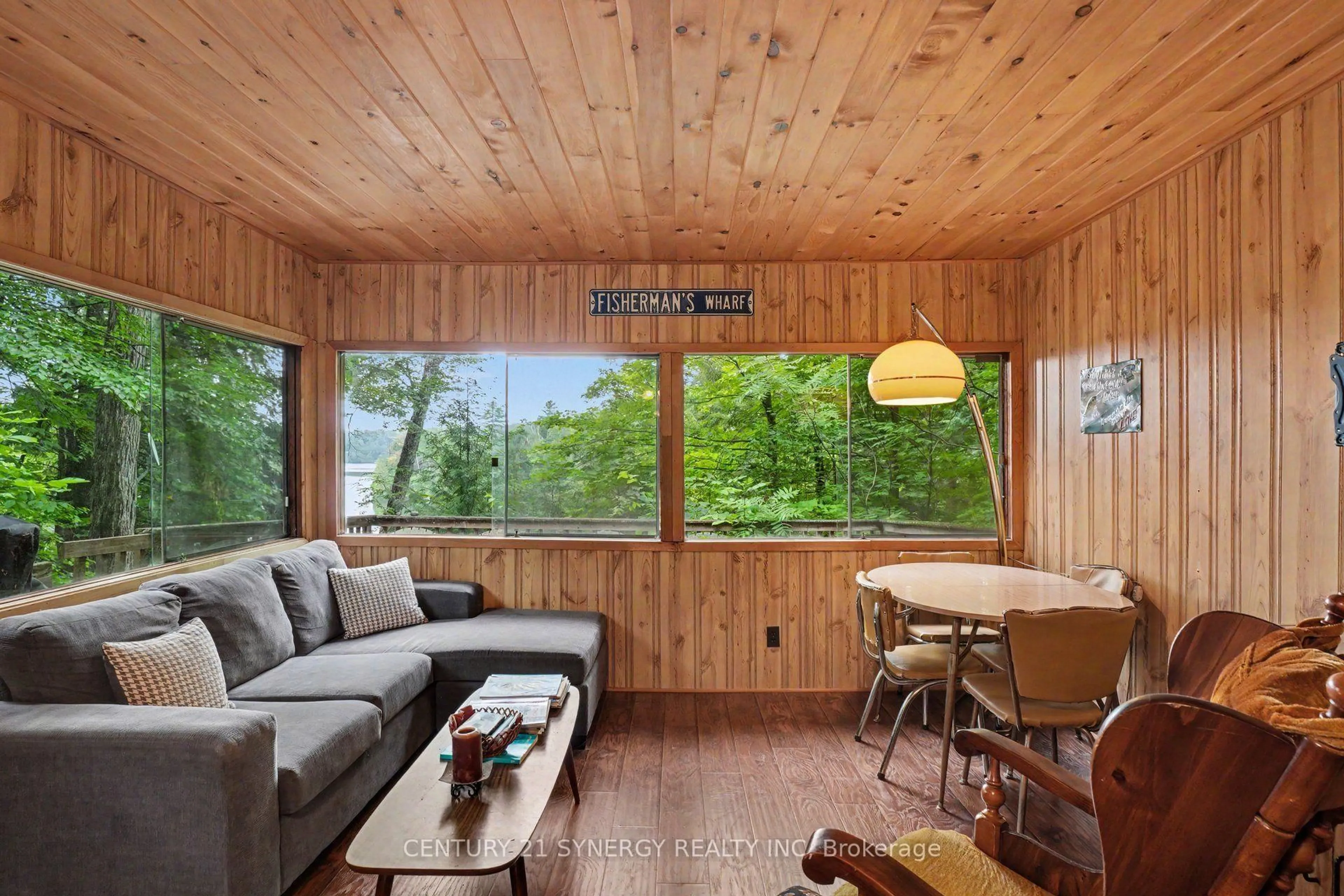 Living room with furniture, wood/laminate floor for 1362 Mosque Lake Lane, Plevna Ontario K0H 2M0