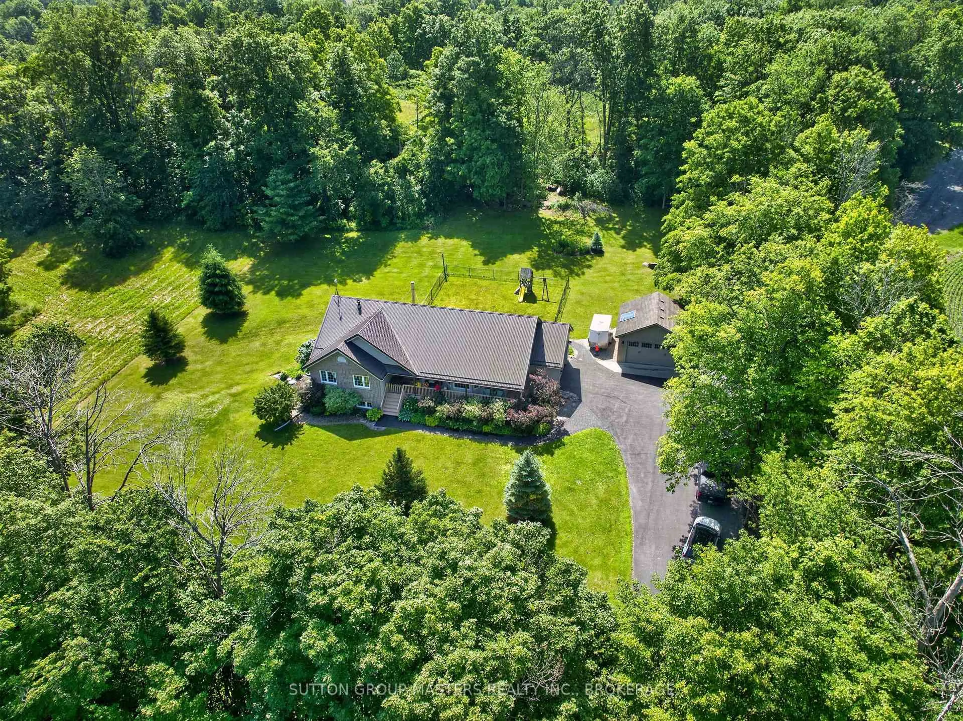 A pic from outside/outdoor area/front of a property/back of a property/a pic from drone, forest/trees view for 710 Maple Rd, Bissett Creek Ontario K0H 2H0