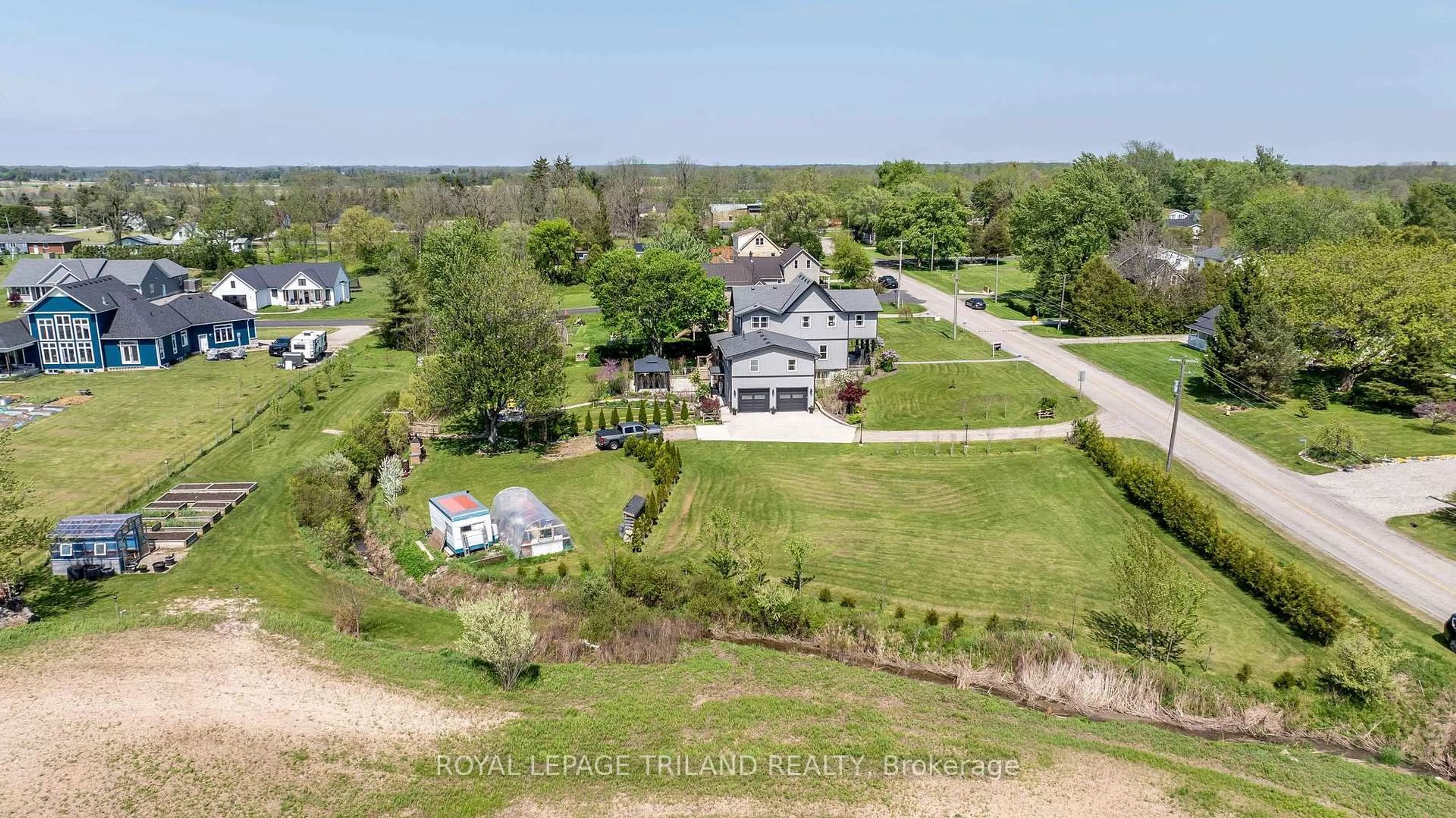 A pic from outside/outdoor area/front of a property/back of a property/a pic from drone, water/lake/river/ocean view for 33134 BACK St, Dutton/Dunwich Ontario N0L 1P0