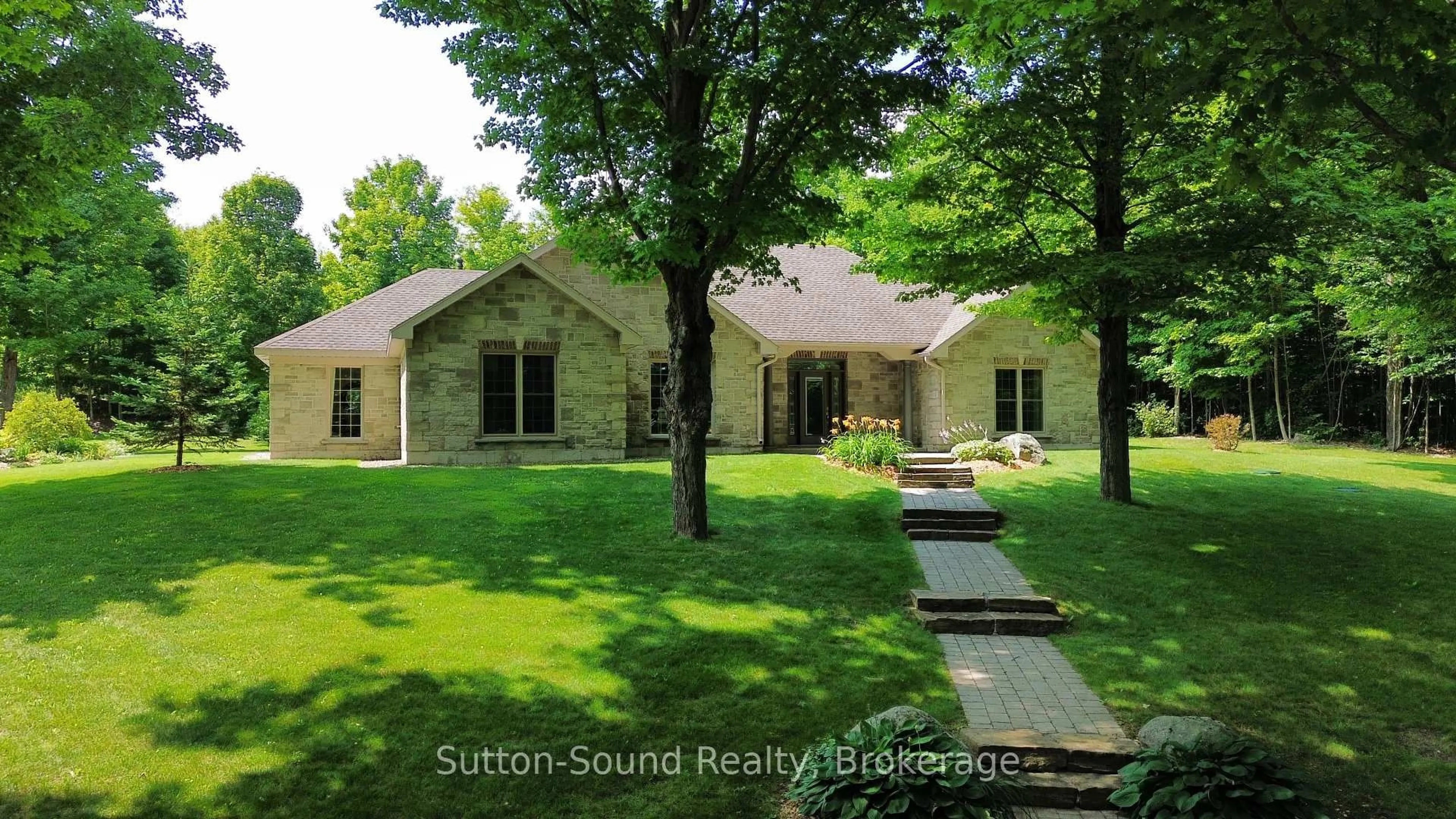 Home with brick exterior material, street for 505556 Grey Road 1 Rd, Georgian Bluffs Ontario N0H 1S0