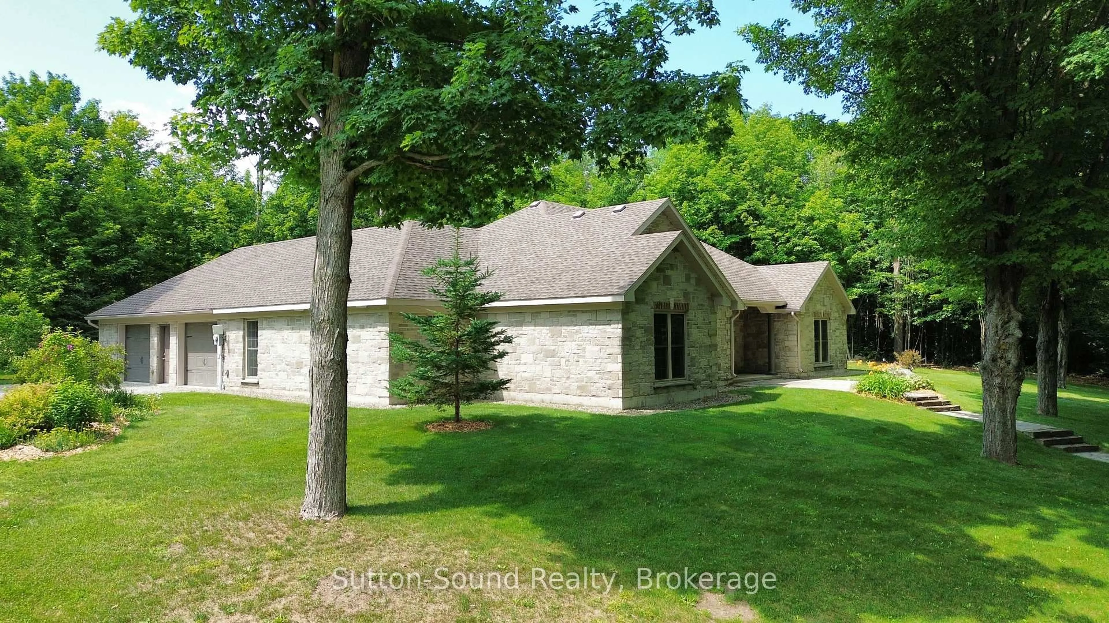 Home with brick exterior material, unknown for 505556 Grey Road 1 Rd, Georgian Bluffs Ontario N0H 1S0