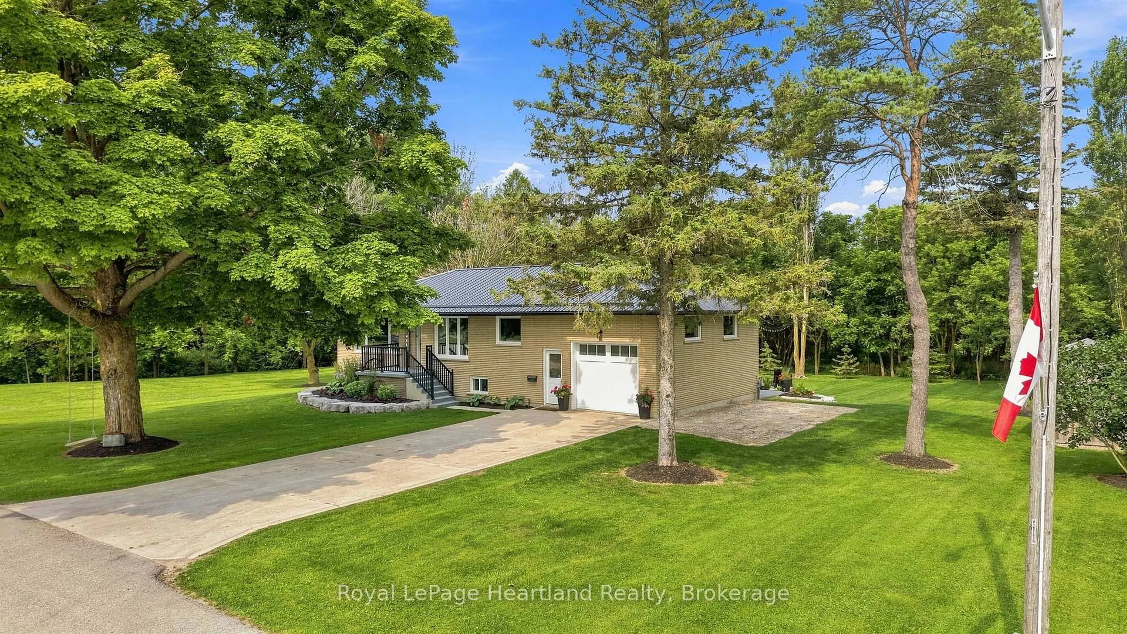 A pic from outside/outdoor area/front of a property/back of a property/a pic from drone, street for 20 QUEEN St, Minto Ontario N0G 1M0