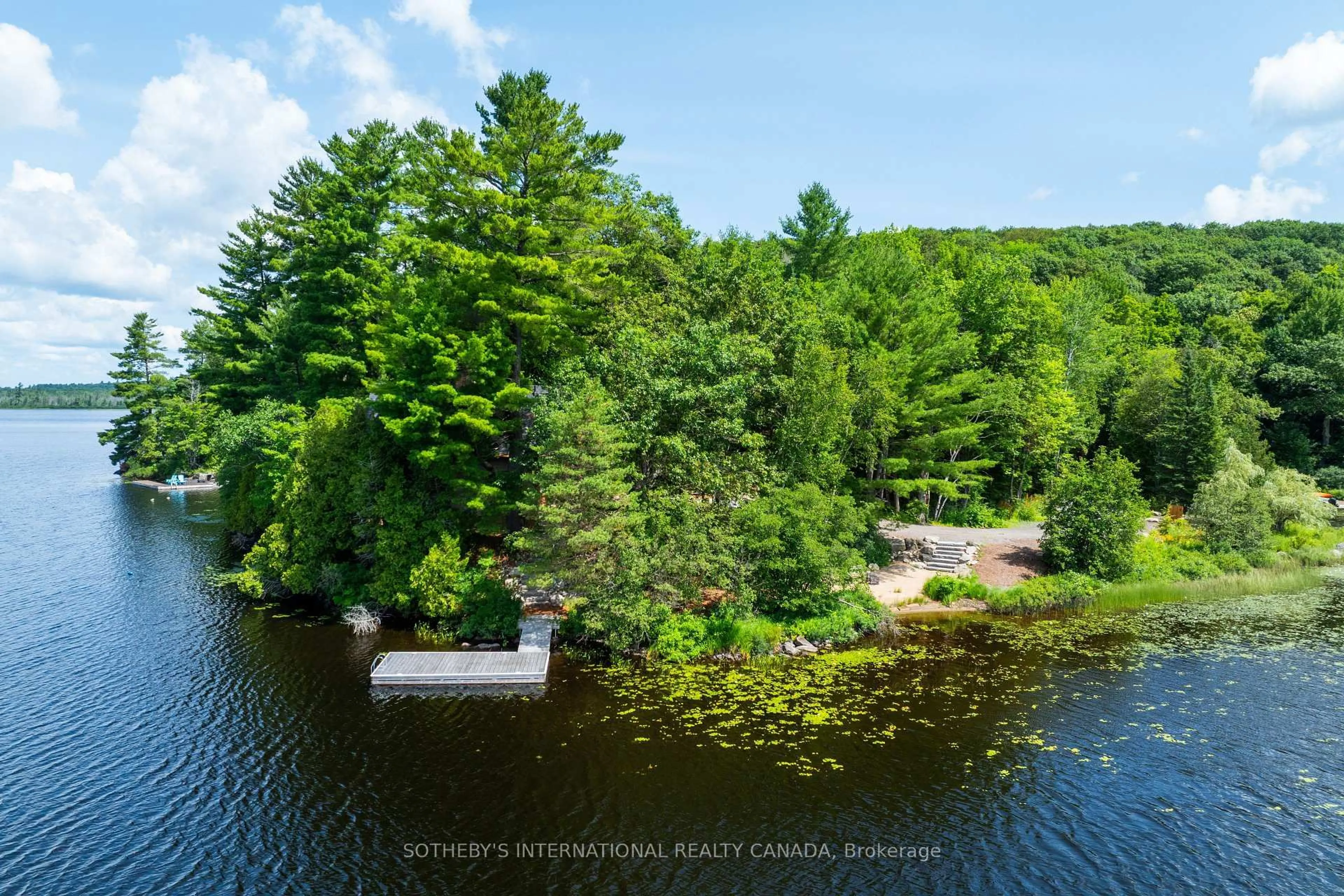 A pic from outside/outdoor area/front of a property/back of a property/a pic from drone, water/lake/river/ocean view for 1023 McCabe Rd, Lake of Bays Ontario P0B 1A0