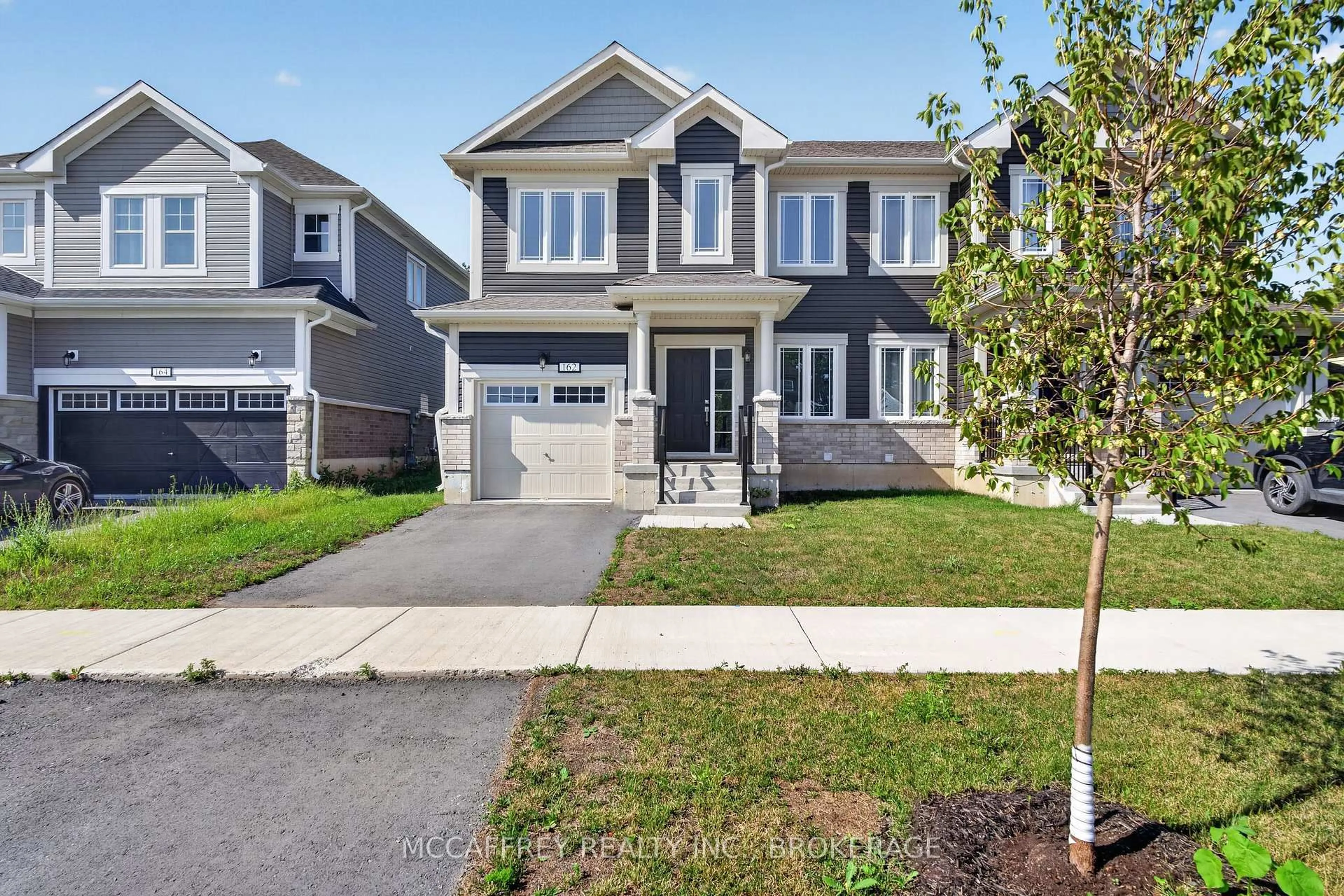 Home with vinyl exterior material, street for 162 Purdy Rd, Bath Ontario K0H 1G0