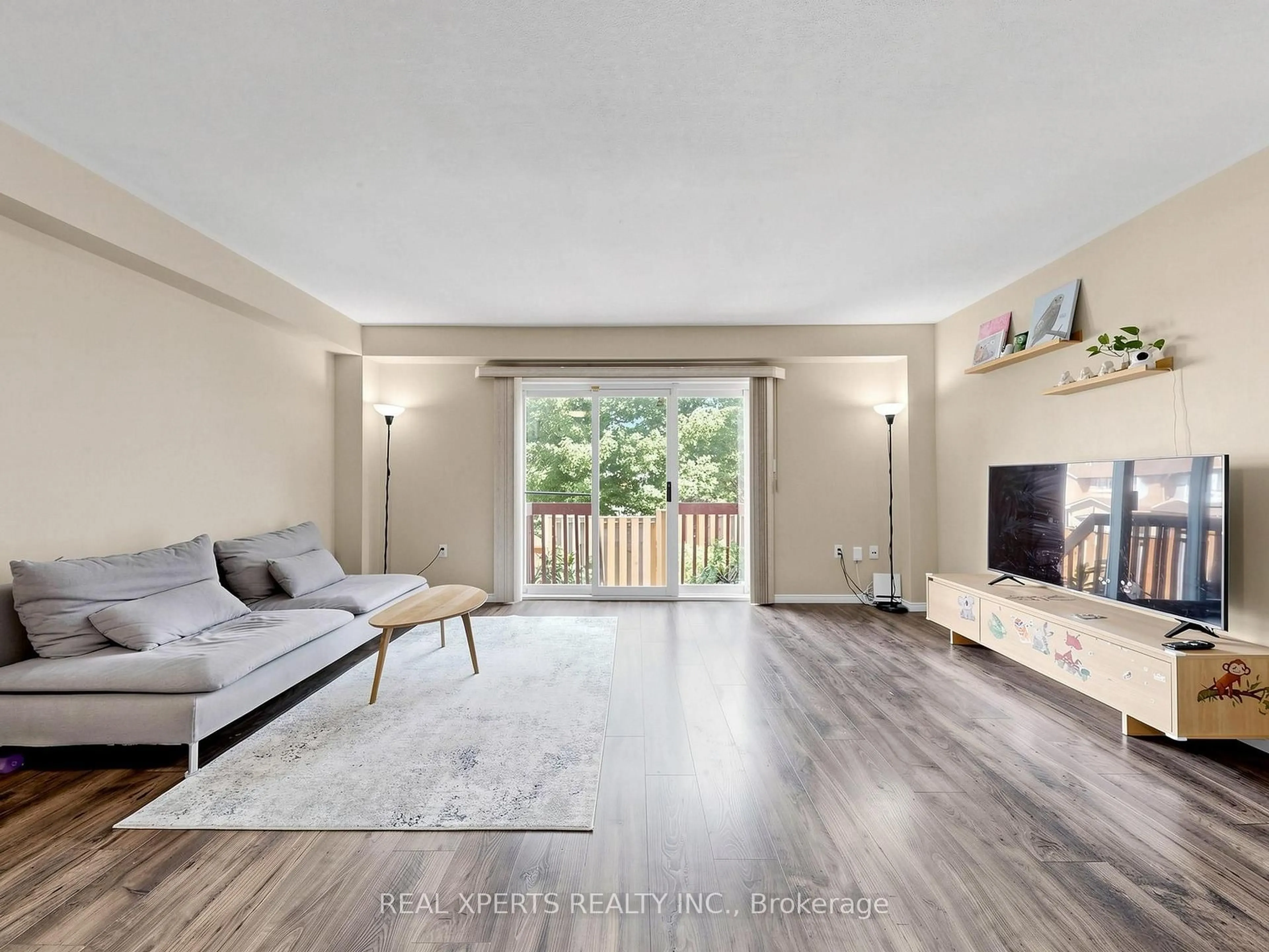Living room with furniture, wood/laminate floor for 346 Highland Rd #34, Hamilton Ontario L8J 3T3