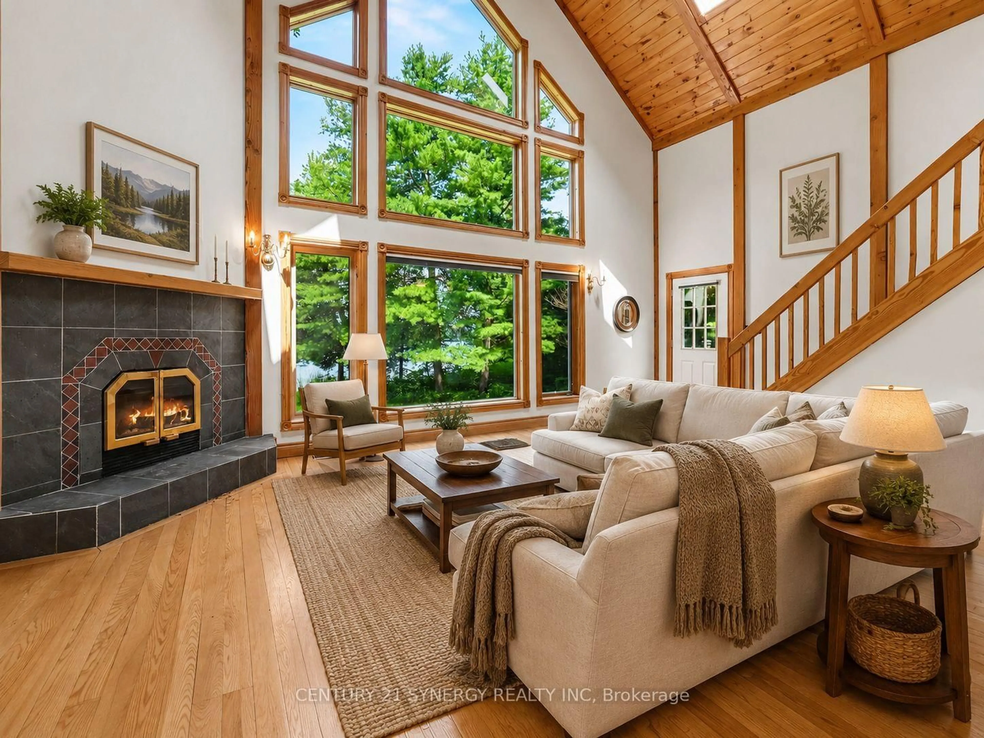 Living room with furniture, wood/laminate floor for 1430 Wagner Rd, Sharbot Lake Ontario K0H 2P0