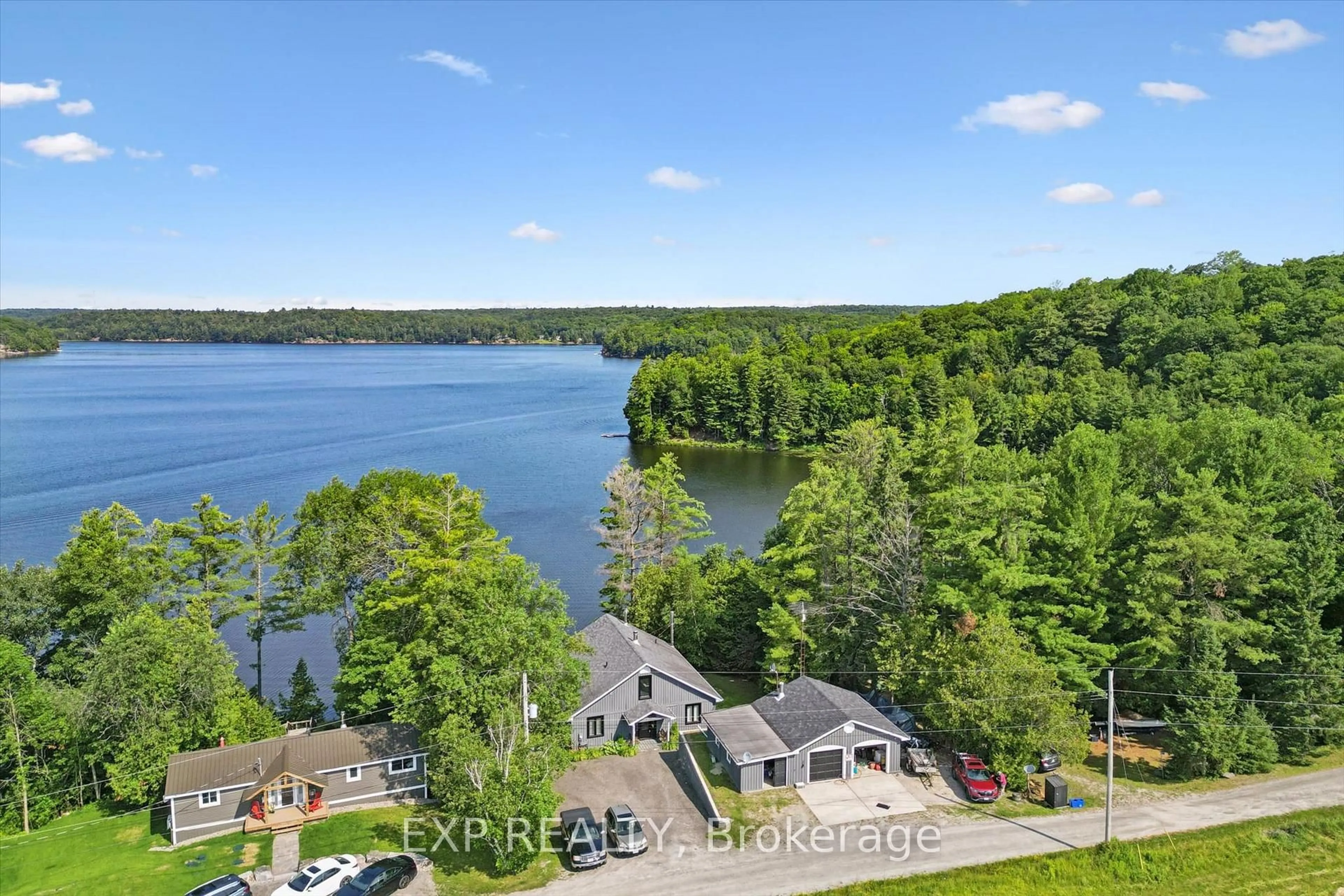 A pic from outside/outdoor area/front of a property/back of a property/a pic from drone, water/lake/river/ocean view for 1378 THREE MILE LAKE Rd #3, Muskoka Lakes Ontario P0B 1M0