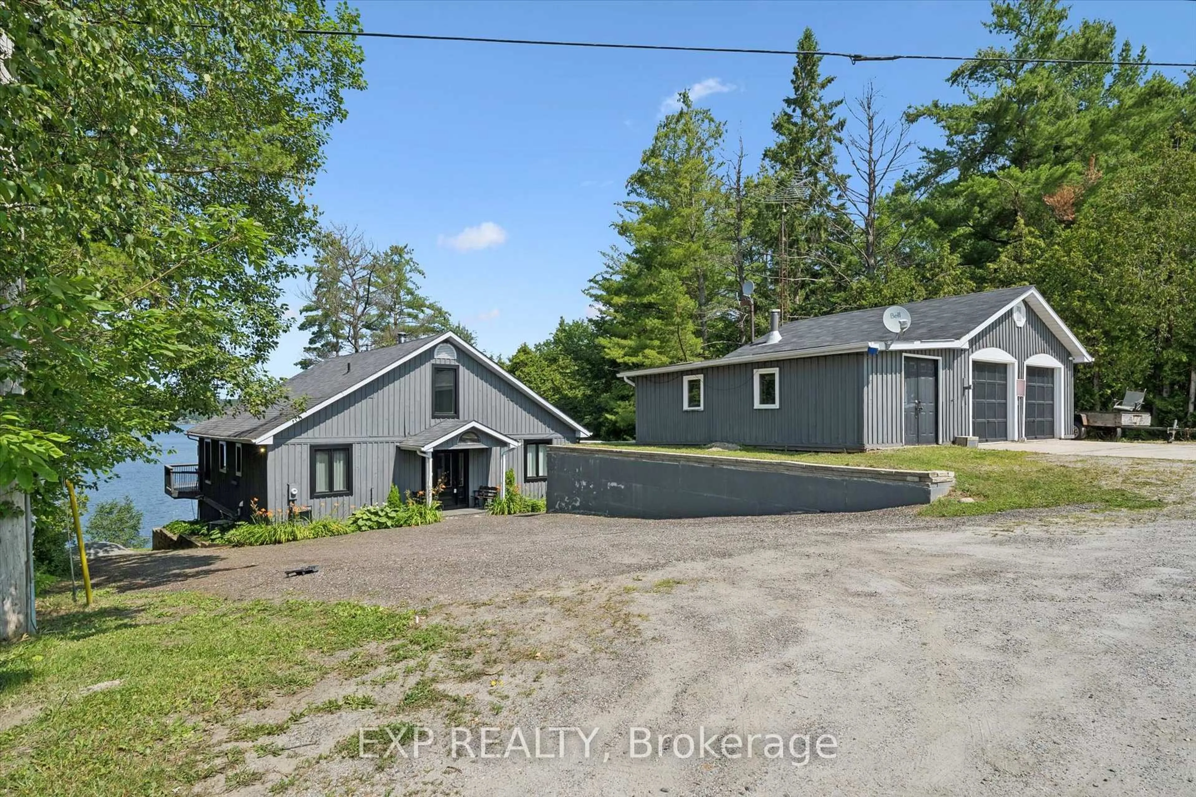 A pic from outside/outdoor area/front of a property/back of a property/a pic from drone, building for 1378 THREE MILE LAKE Rd #3, Muskoka Lakes Ontario P0B 1M0