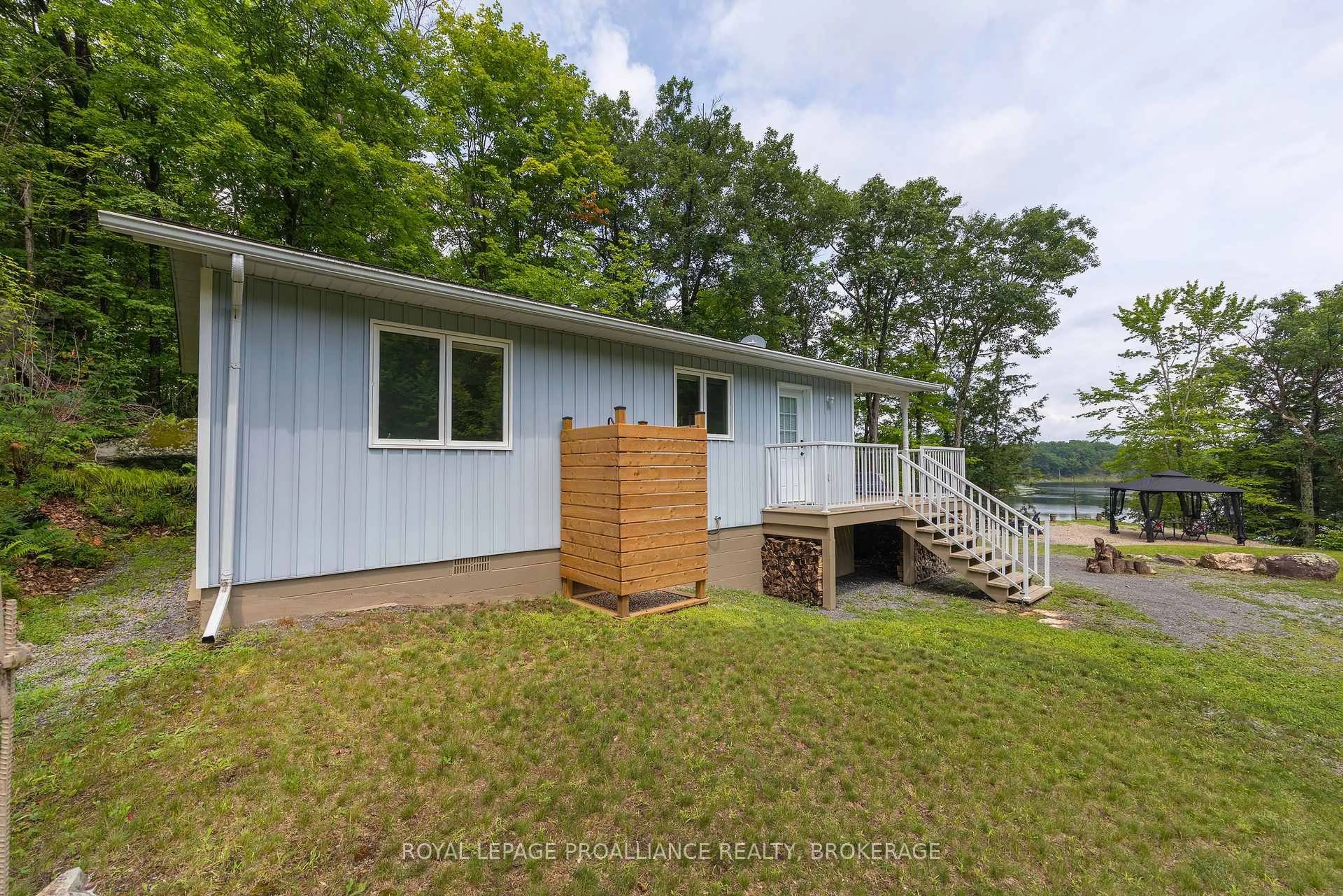A pic from outside/outdoor area/front of a property/back of a property/a pic from drone, water/lake/river/ocean view for 59 Sunset Shores Lane, Godfrey Ontario K0H 1T0