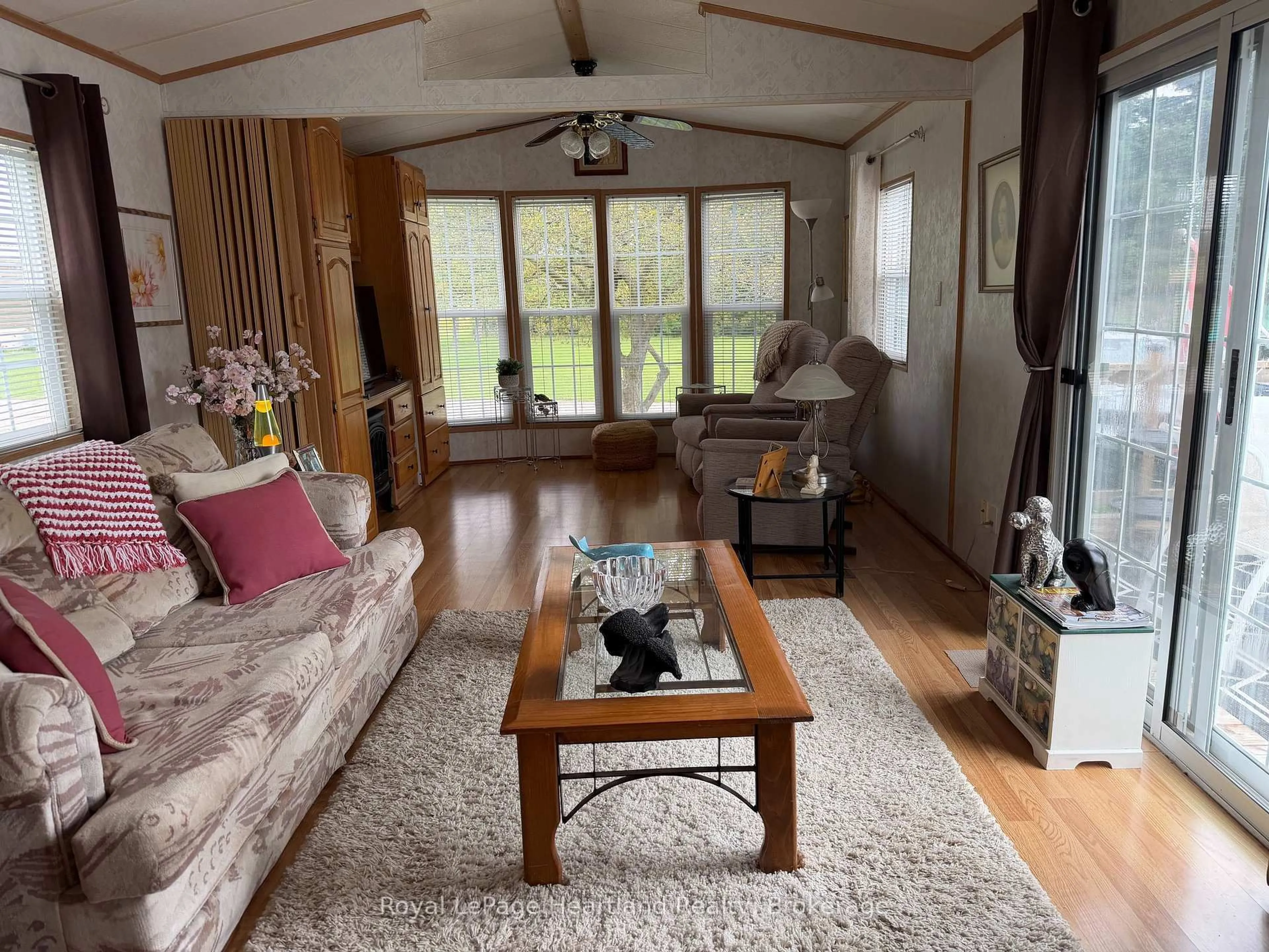 Living room with furniture, wood/laminate floor for 77719 BLUEWATER HWY-45 PORTSIDE Highway, Central Huron Ontario N0M 1G0