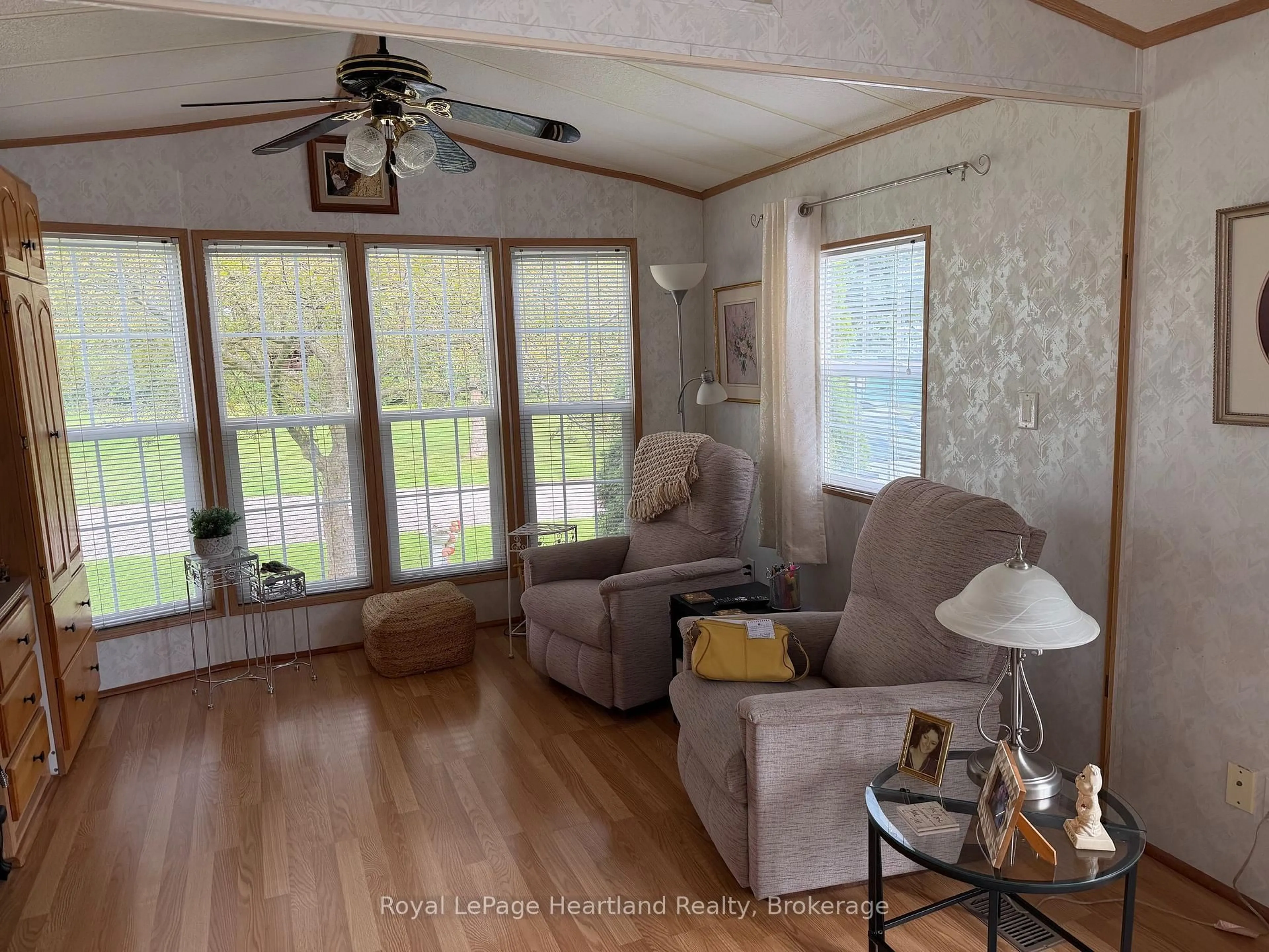 Living room with furniture, wood/laminate floor for 77719 BLUEWATER HWY-45 PORTSIDE Highway, Central Huron Ontario N0M 1G0