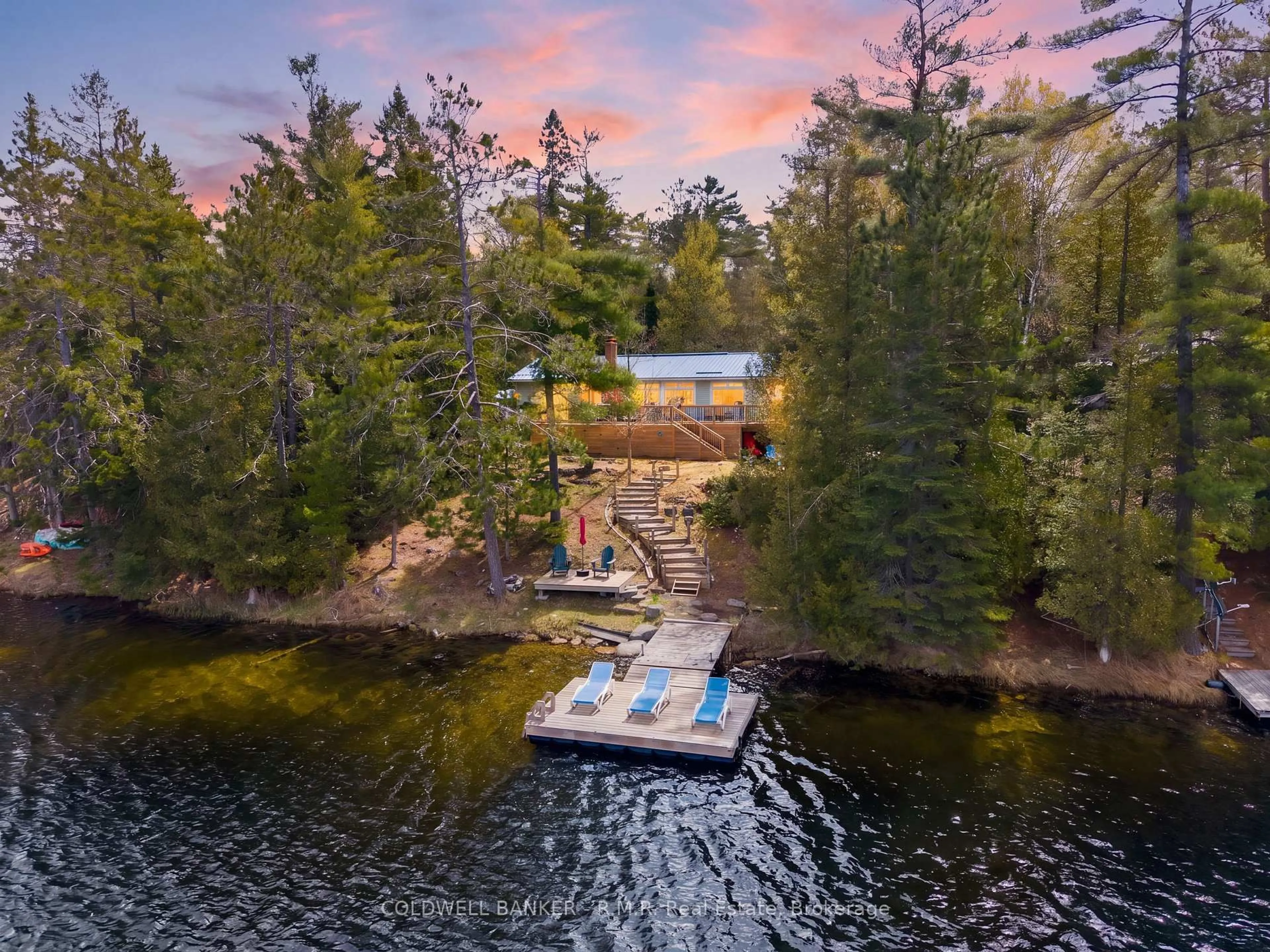 A pic from outside/outdoor area/front of a property/back of a property/a pic from drone, water/lake/river/ocean view for 63 Little Silver Lake Way, Trent Lakes Ontario K0M 1A0