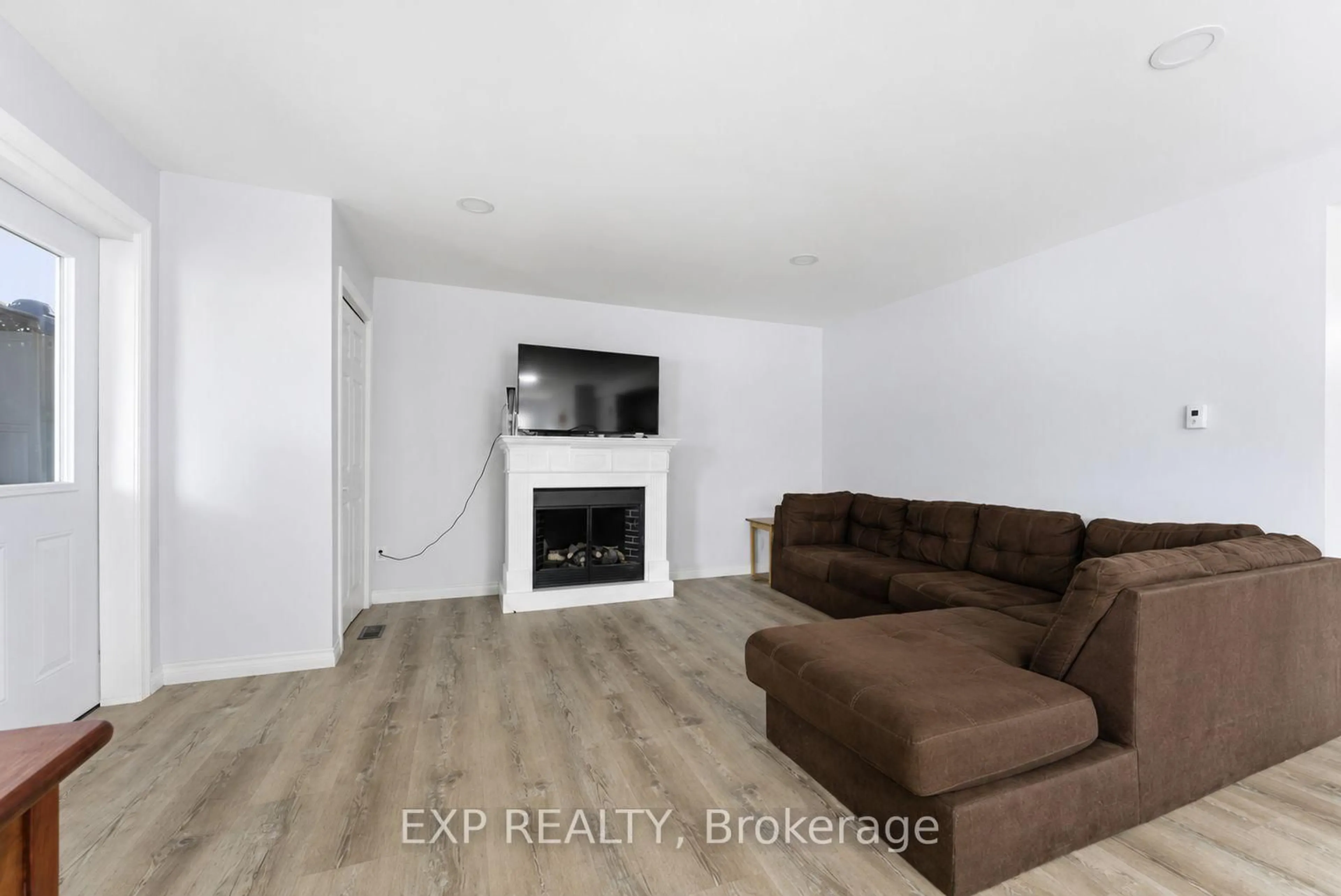 Living room with furniture, wood/laminate floor for 23B Mother's Rd, Tweed Ontario K0K 3J0