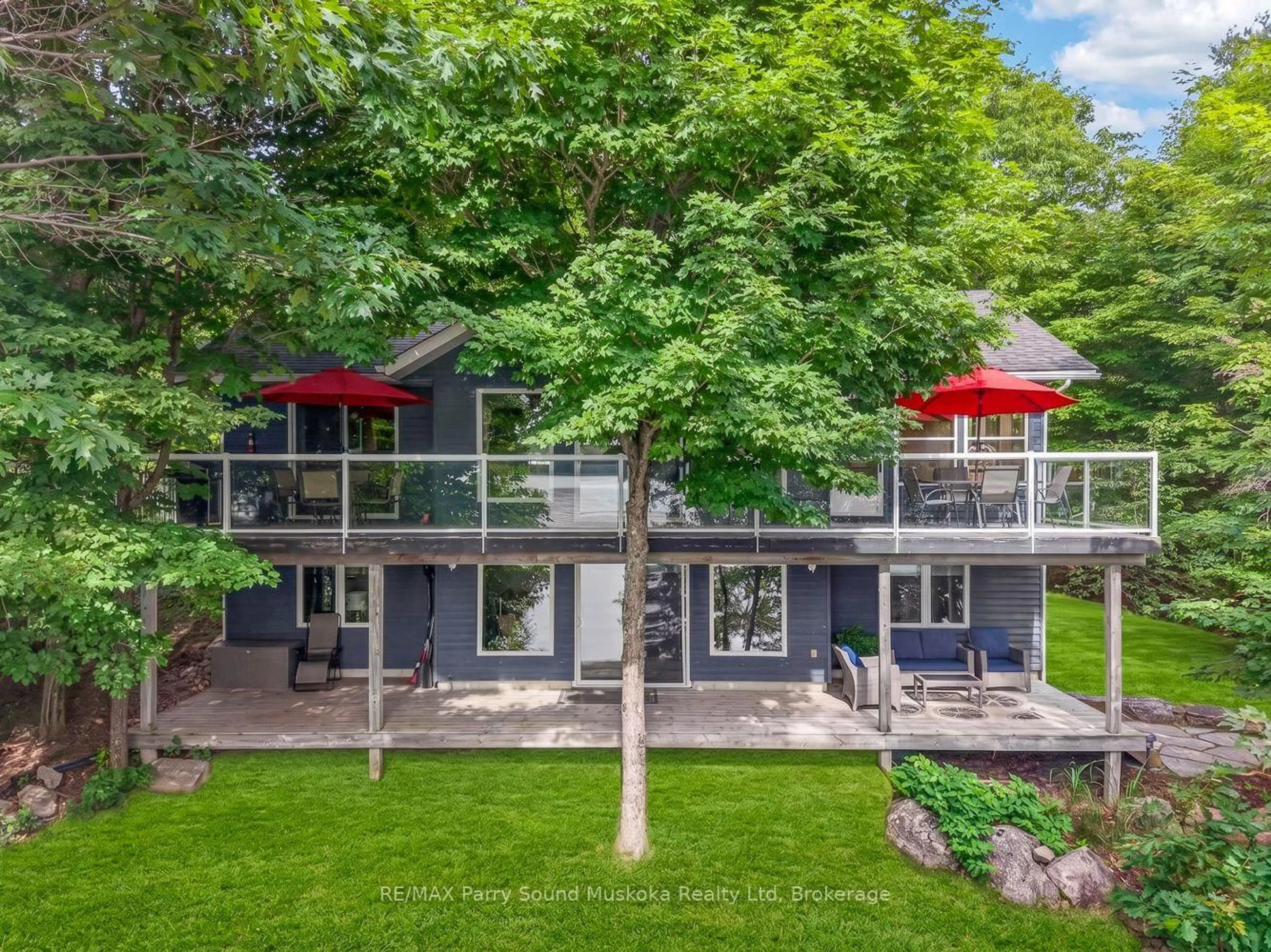 A pic from outside/outdoor area/front of a property/back of a property/a pic from drone, unknown for 54 Dauncey Rd, Magnetawan Ontario P0A 1P0
