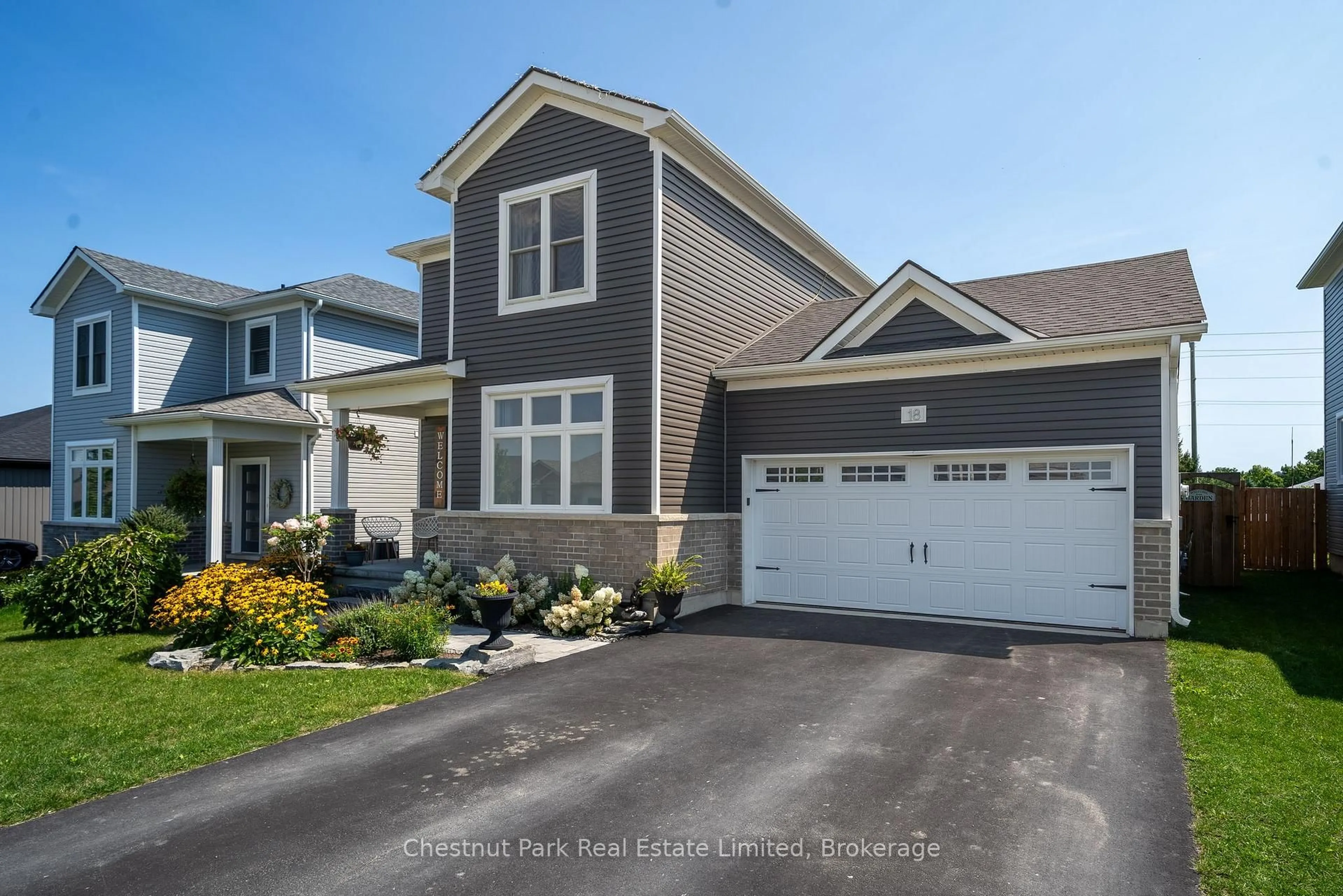 Home with vinyl exterior material, street for 18 Curtis St, Prince Edward County Ontario K0K 2T0