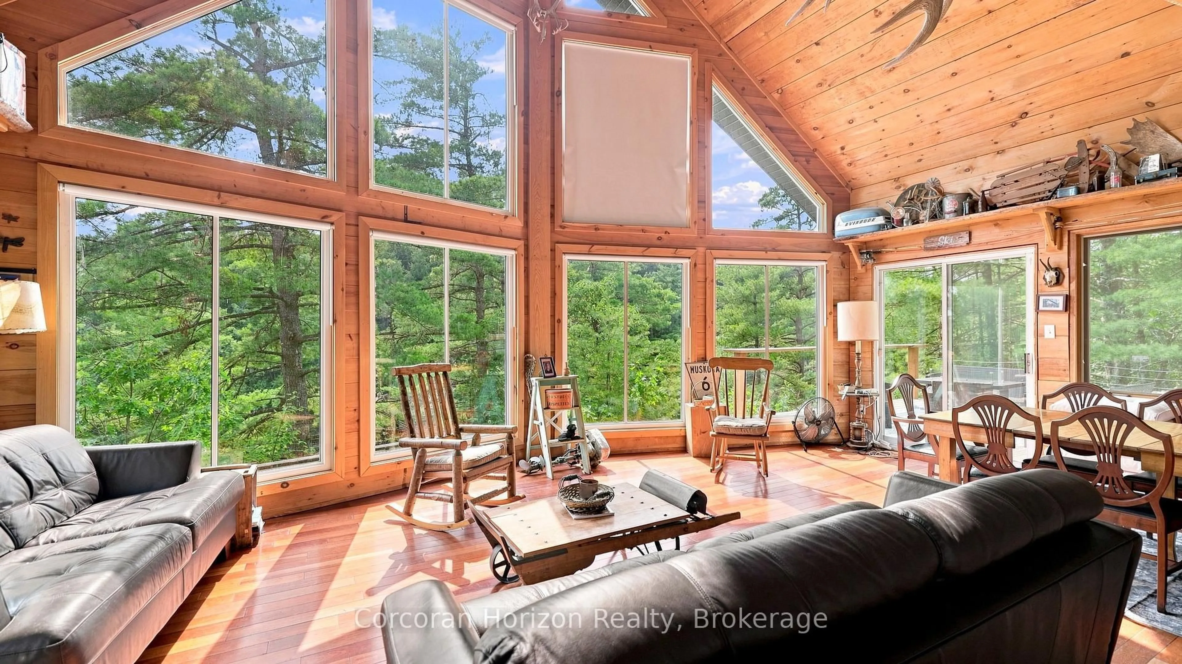 Living room with furniture, wood/laminate floor for 1316 Wahta #2 Rd, Georgian Bay Ontario P0C 1A0