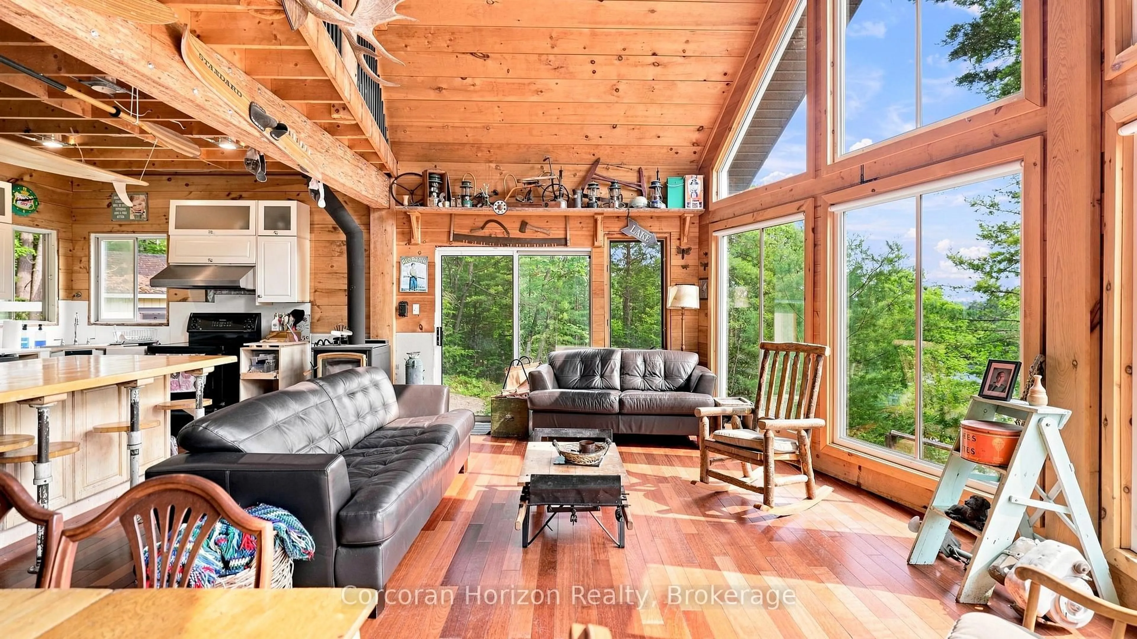 Living room with furniture, wood/laminate floor for 1316 Wahta #2 Rd, Georgian Bay Ontario P0C 1A0